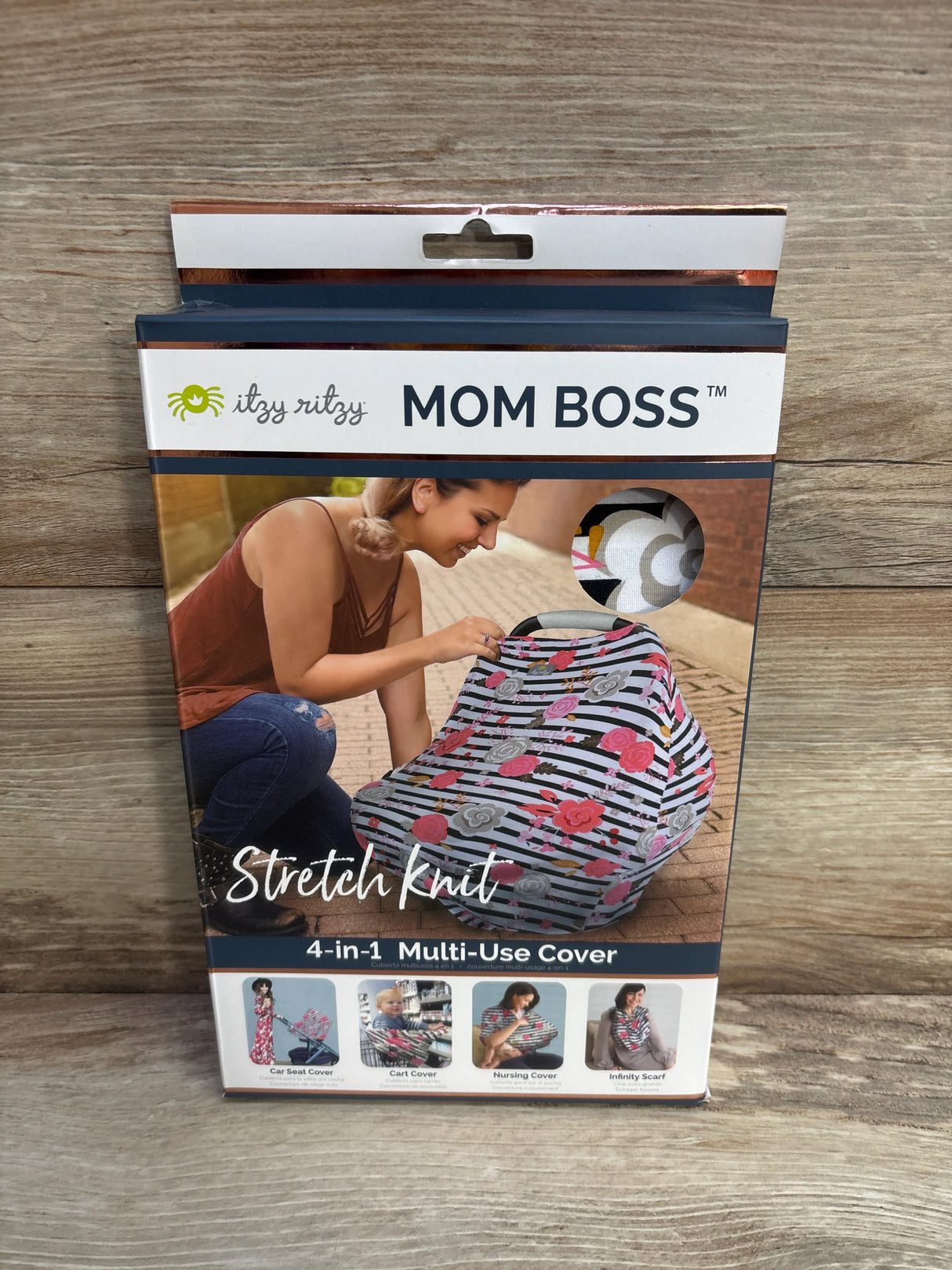 Itzy Ritzy Mom Boss stretch knit 4-in-1 multi-use cover package on wood surface