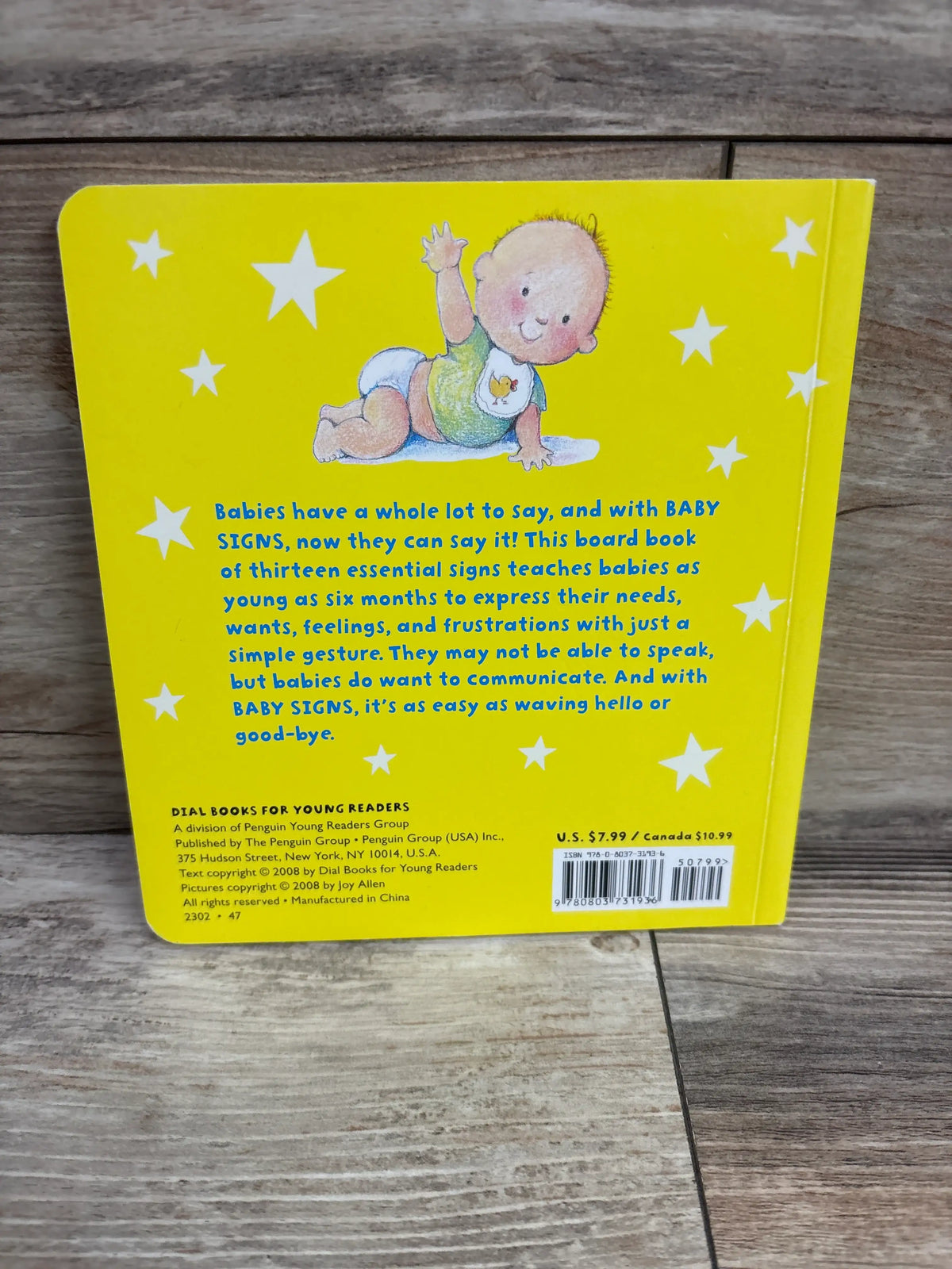 Back cover of Baby Signs Board Book showcasing a yellow cover, baby illustration, and text about thirteen essential signs