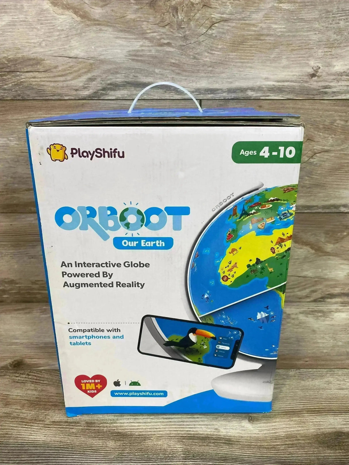 Front of PlayShifu Orboot Earth box showing globe artwork, Ages 4-10 badge and smartphone AR demo on wood background