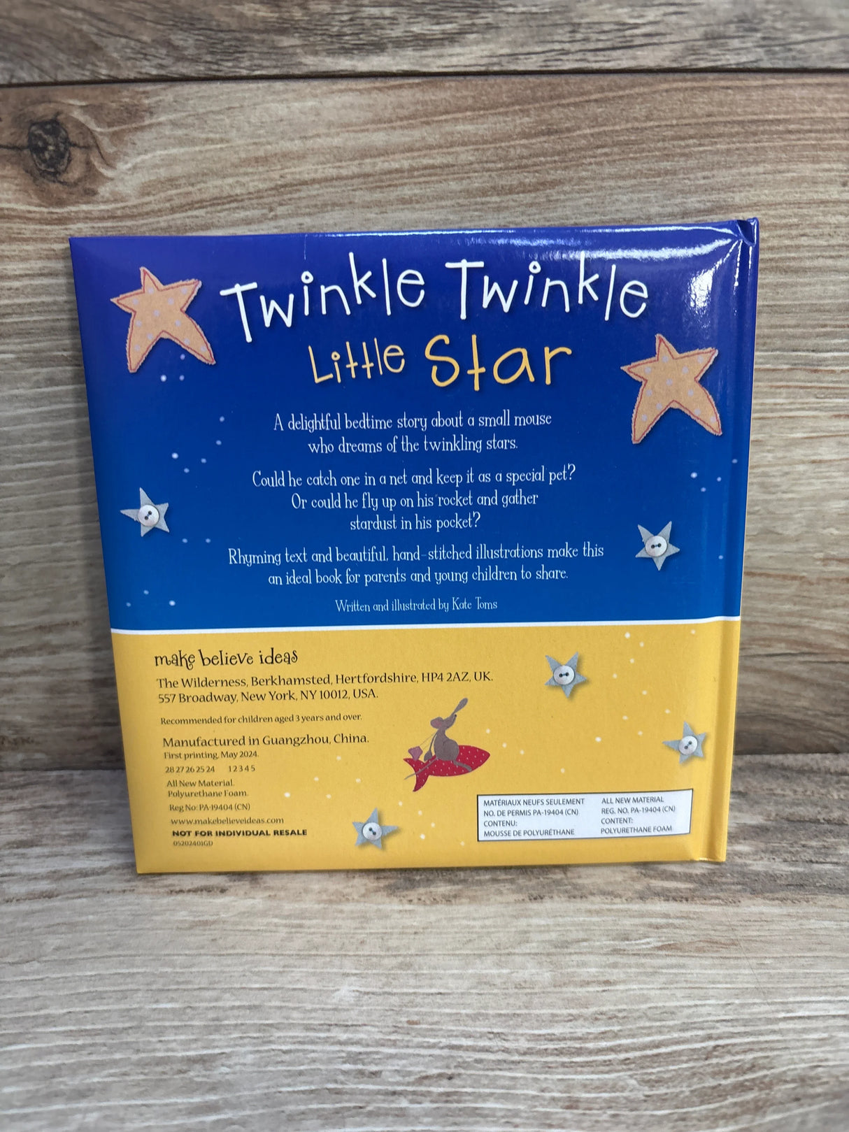 Back cover of Twinkle Twinkle Little Star children's book with star illustrations on wood background
