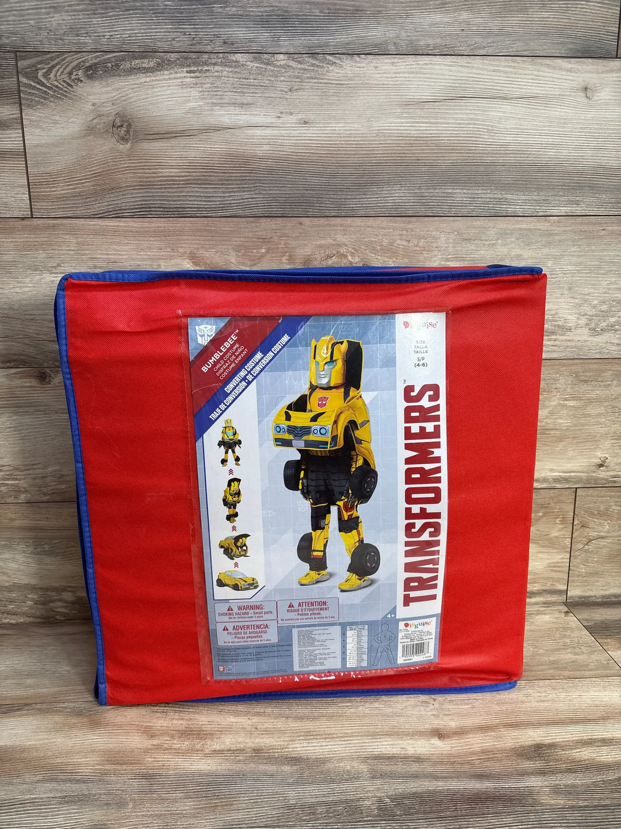 Transformers Bumblebee child costume in red and blue packaging on wooden floor