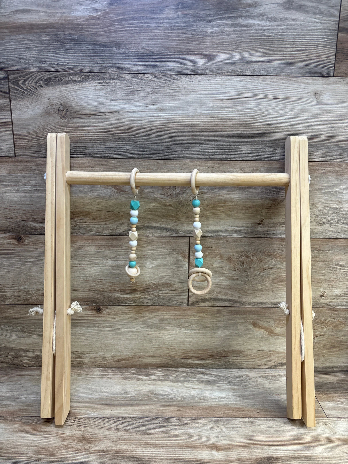 SlickBlue Wooden Play Gym with 2 Hanging Toys