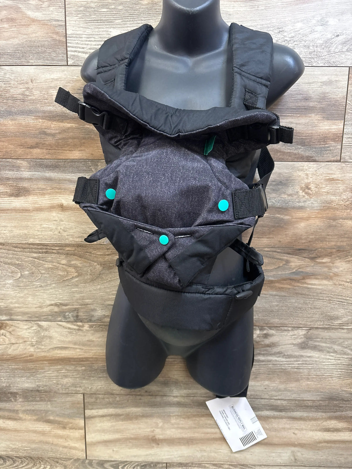 New Infantino Flip 4-in-1 Convertible Baby Carrier in grey on a mannequin