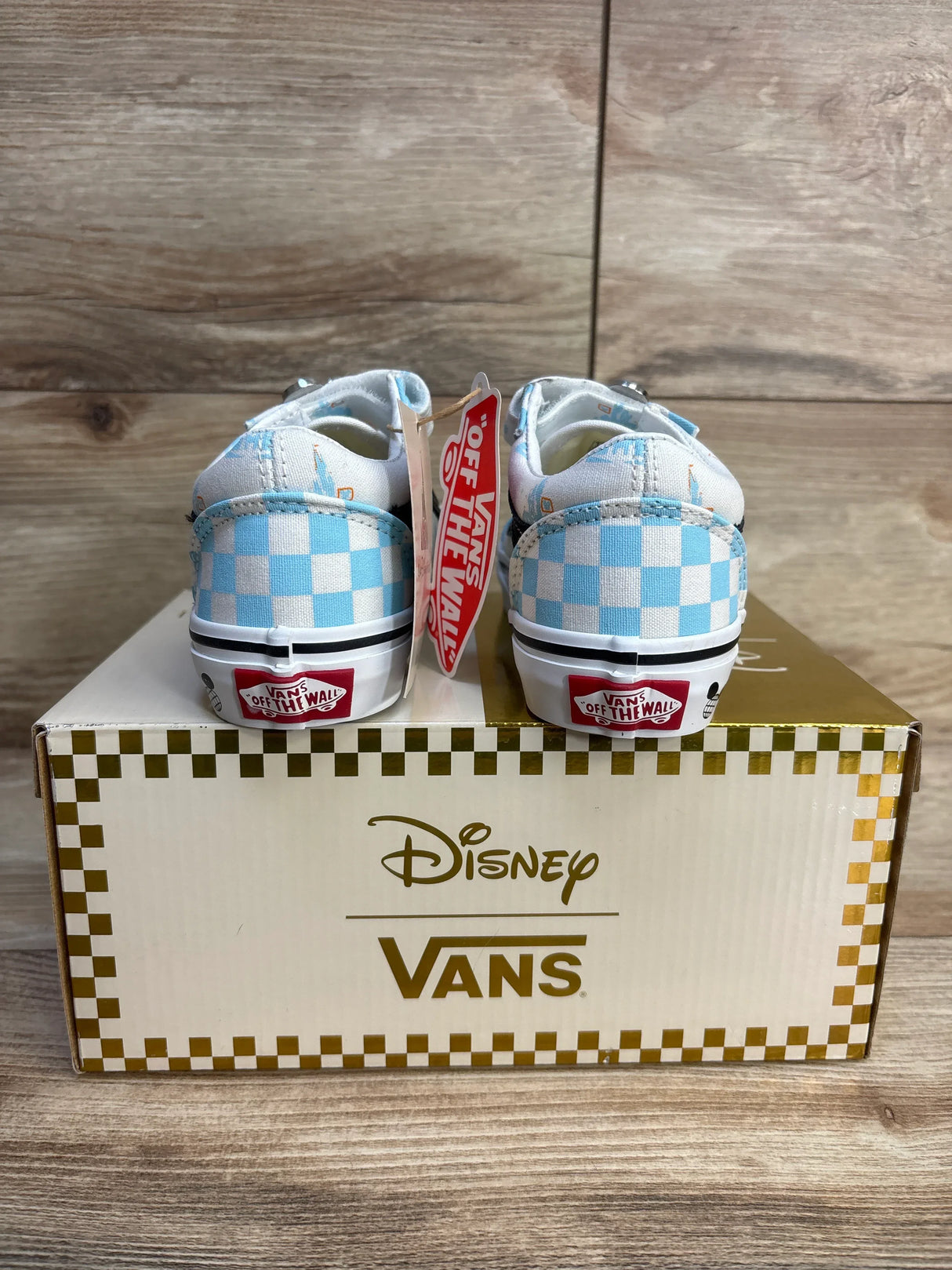 Disney Vans toddler sneakers with blue checkered pattern, displayed on branded box