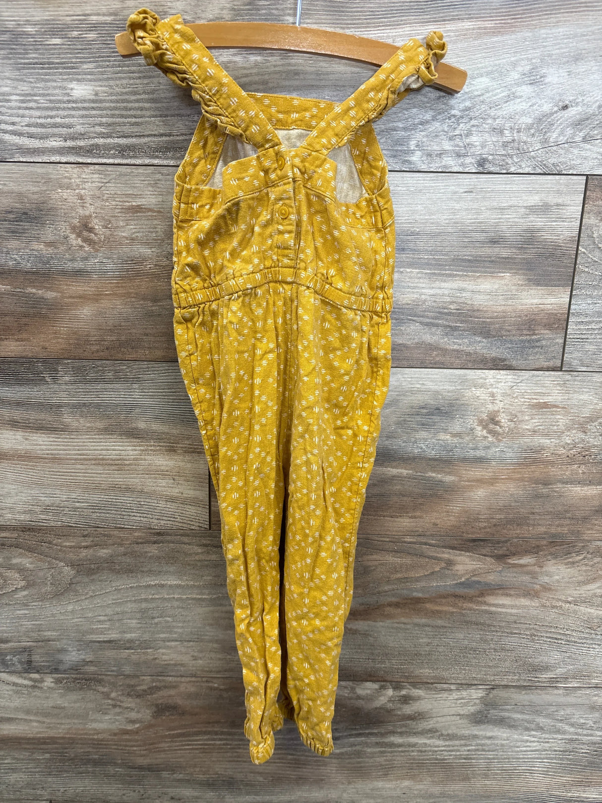 Yellow polka dot baby overalls with ruffled straps, perfect for kids' resale clothing