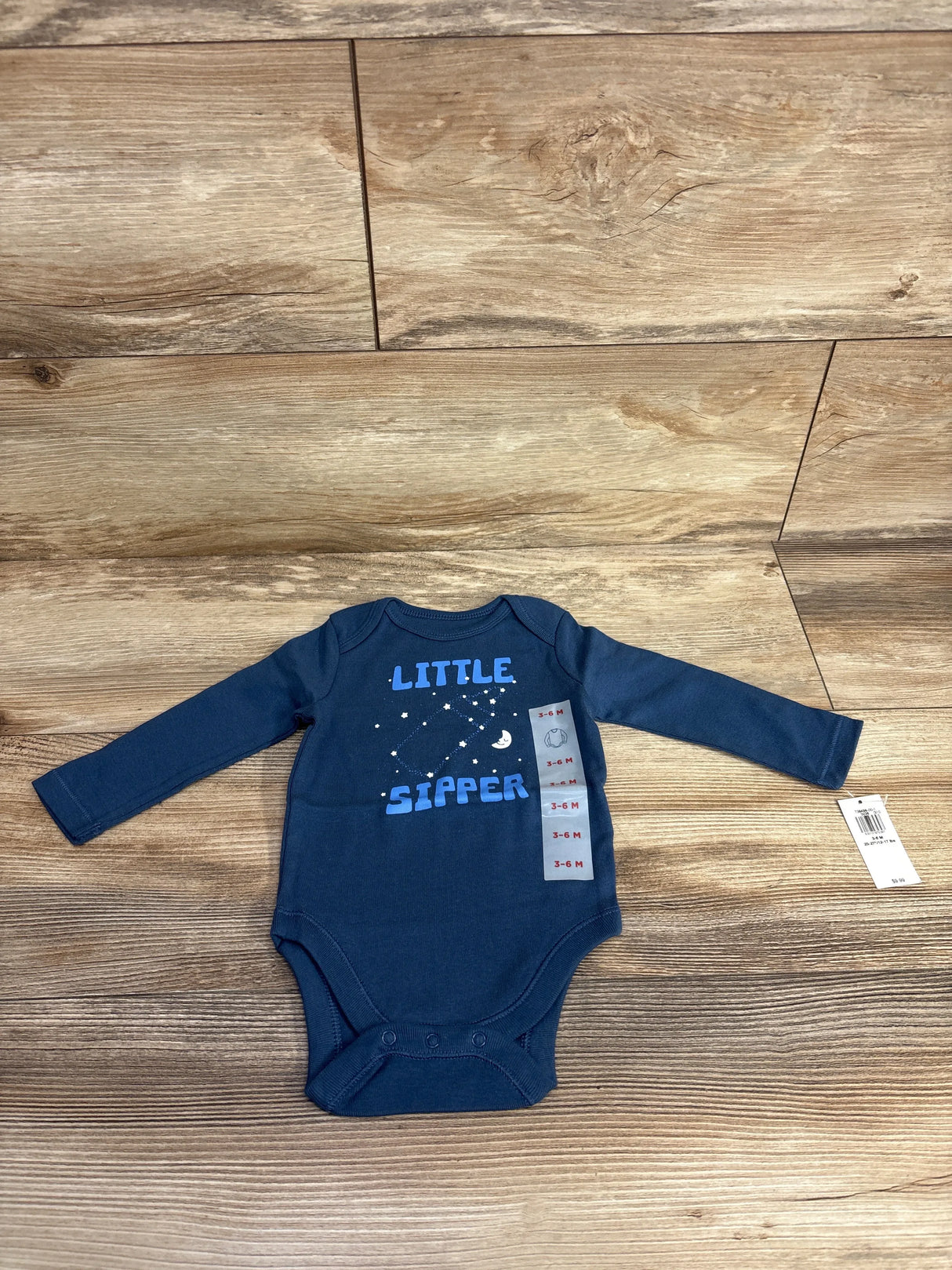 Navy blue long-sleeve baby bodysuit with 'Little Sipper' and moon constellation, size 3-6M