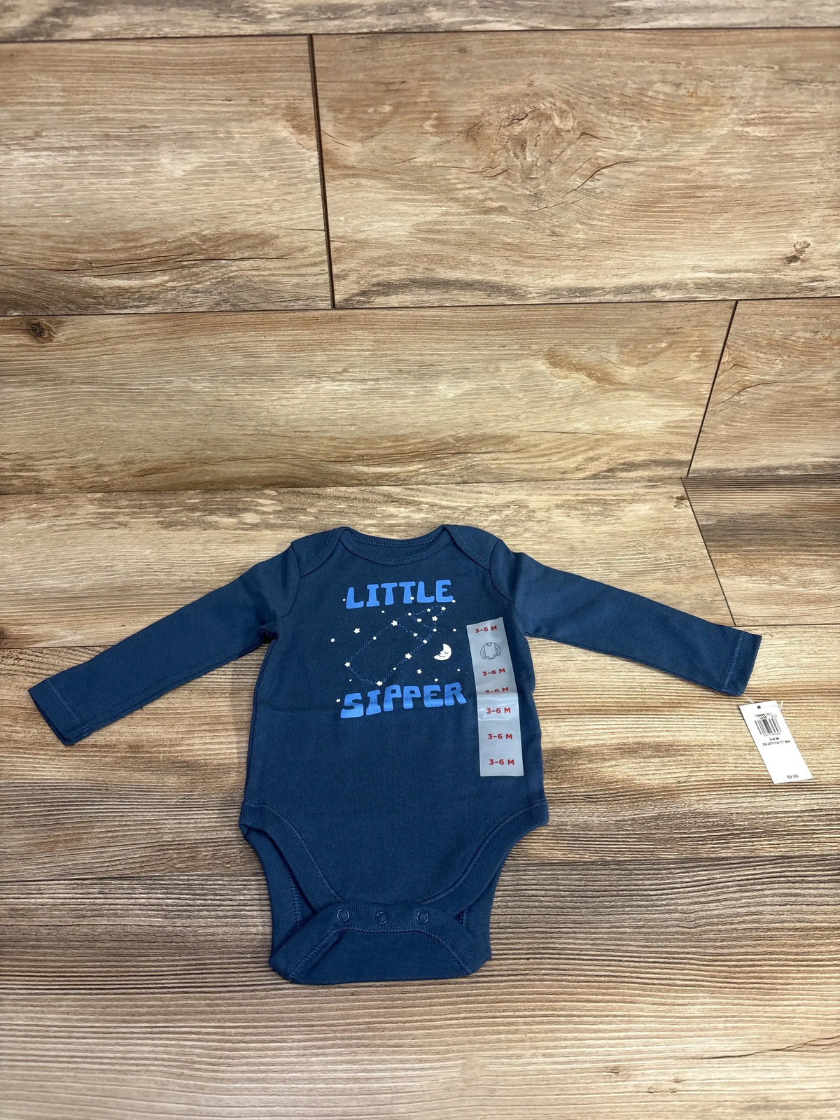 Navy blue long-sleeve baby bodysuit with 'Little Sipper' and moon constellation, size 3-6M
