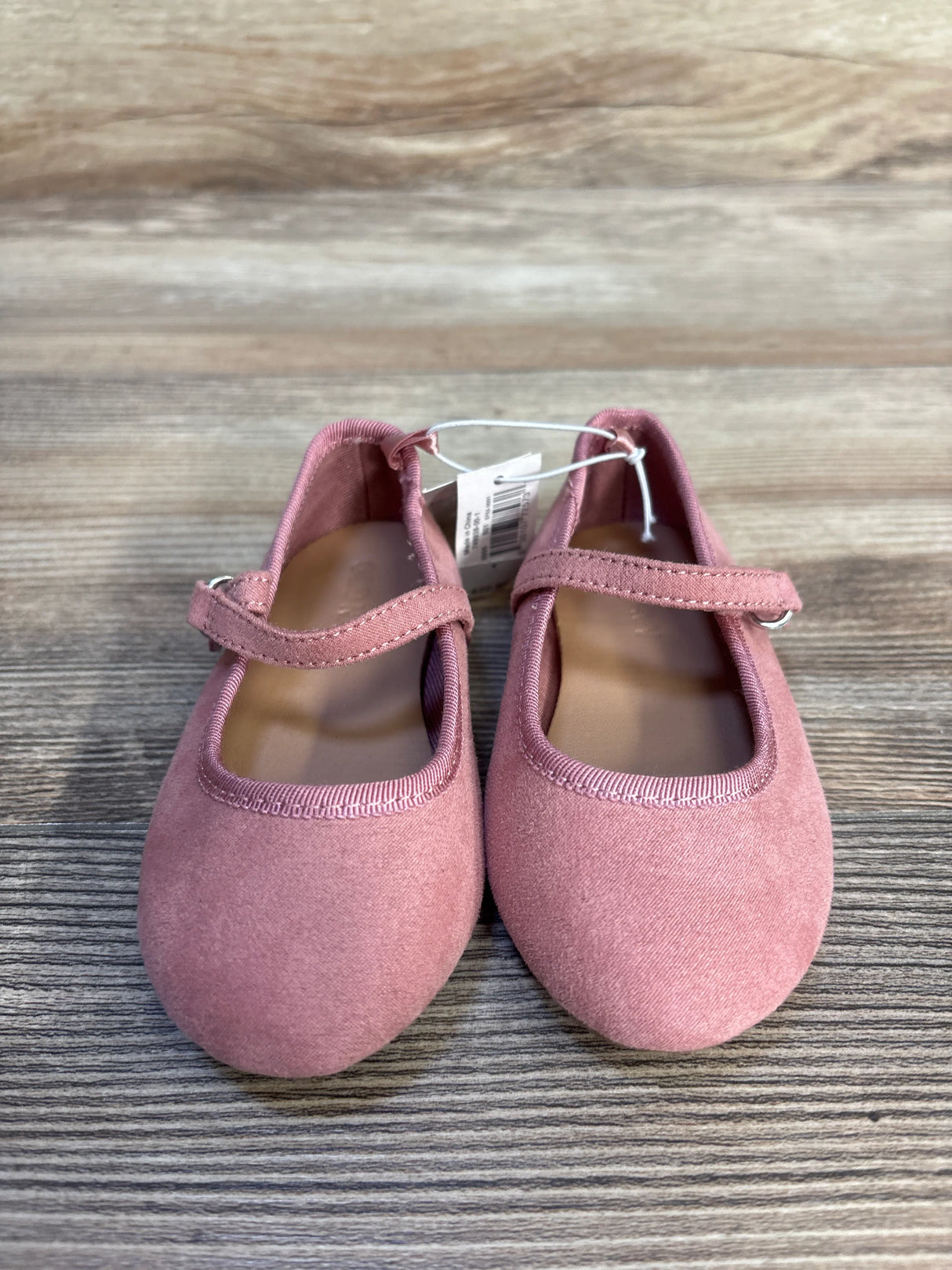Pink toddler Mary Jane shoes with strap, displayed on wood background, resale kids footwear