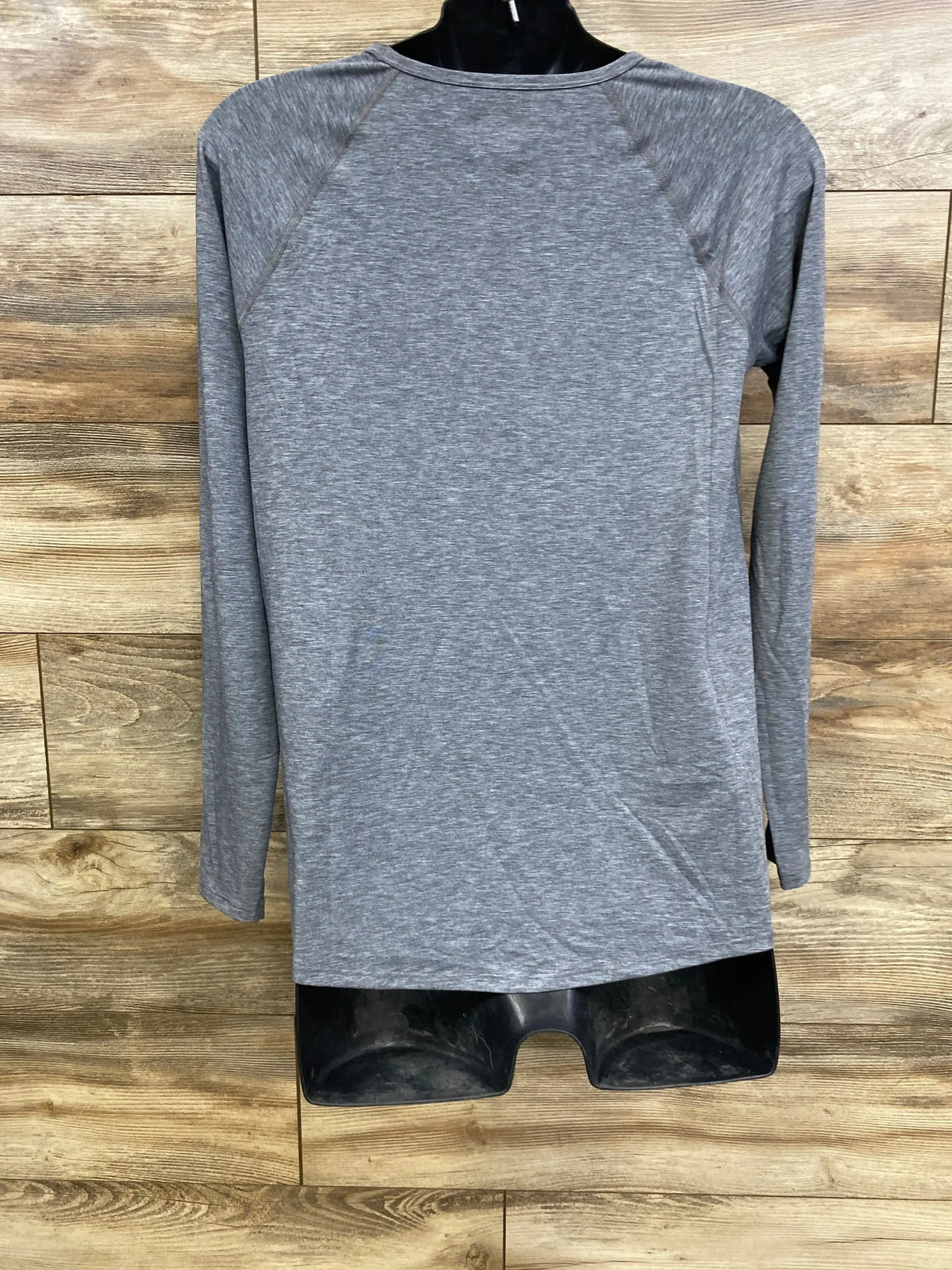 Back view of Gap Maternity Breathe long-sleeve shirt grey showing raglan sleeves on black mannequin with wood background