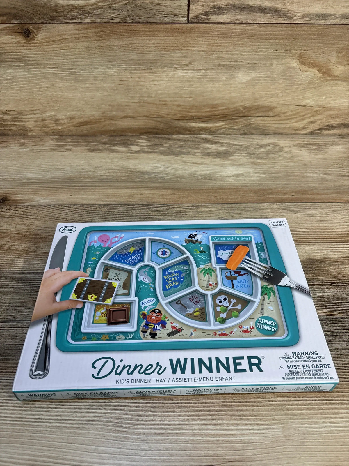 Kid's dinner tray with pirate theme, colorful game design, and sectioned food compartments.