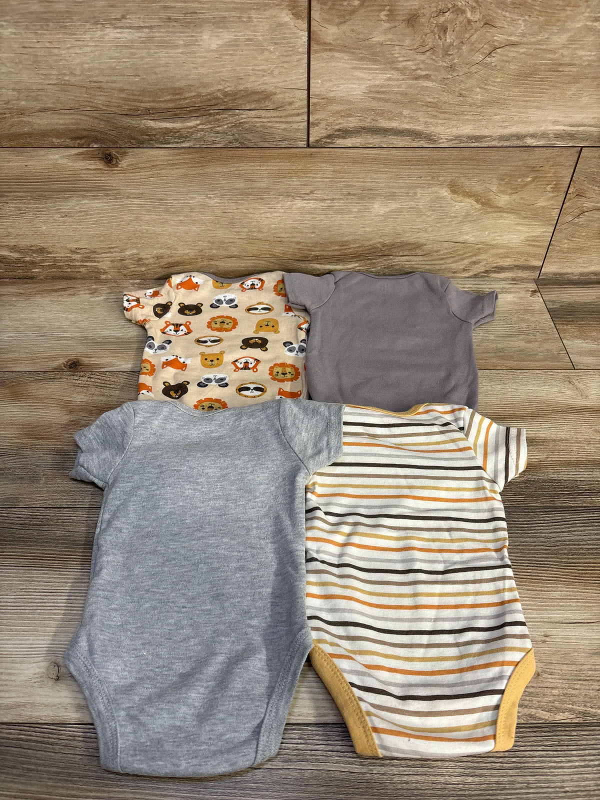 Chick Pea 4pk bodysuit set in grey, striped, and animal prints for babies size 3-6m