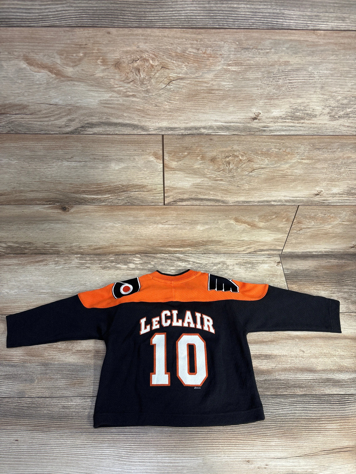 Philadelphia Flyers hockey jersey with LeClair 10 on back, black and orange