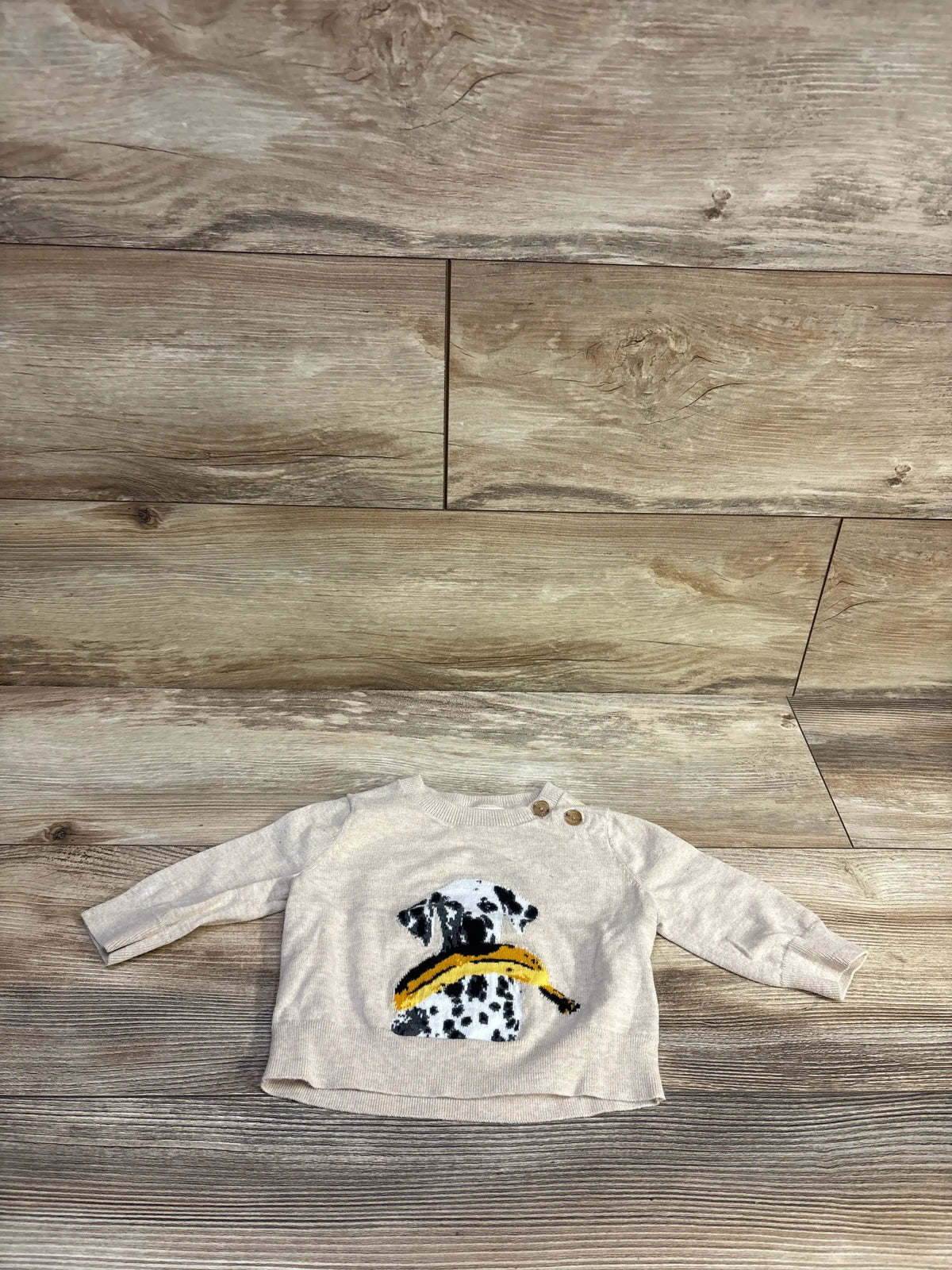 Banana Republic beige intarsia-knit baby sweater featuring a Dalmatian dog with a yellow banana.