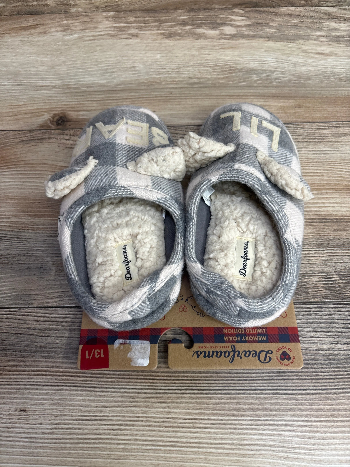 Gray and white plaid Deerfoams toddler slippers with sherpa lining and ears on wood background