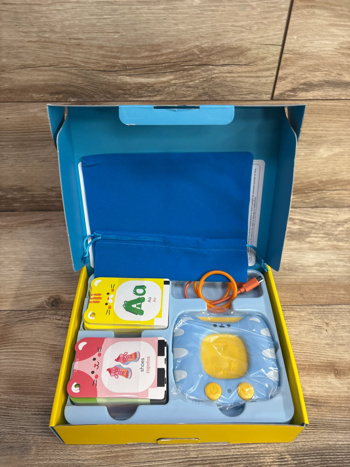 Children’s educational flash card set with electronic reader and charging cable in box
