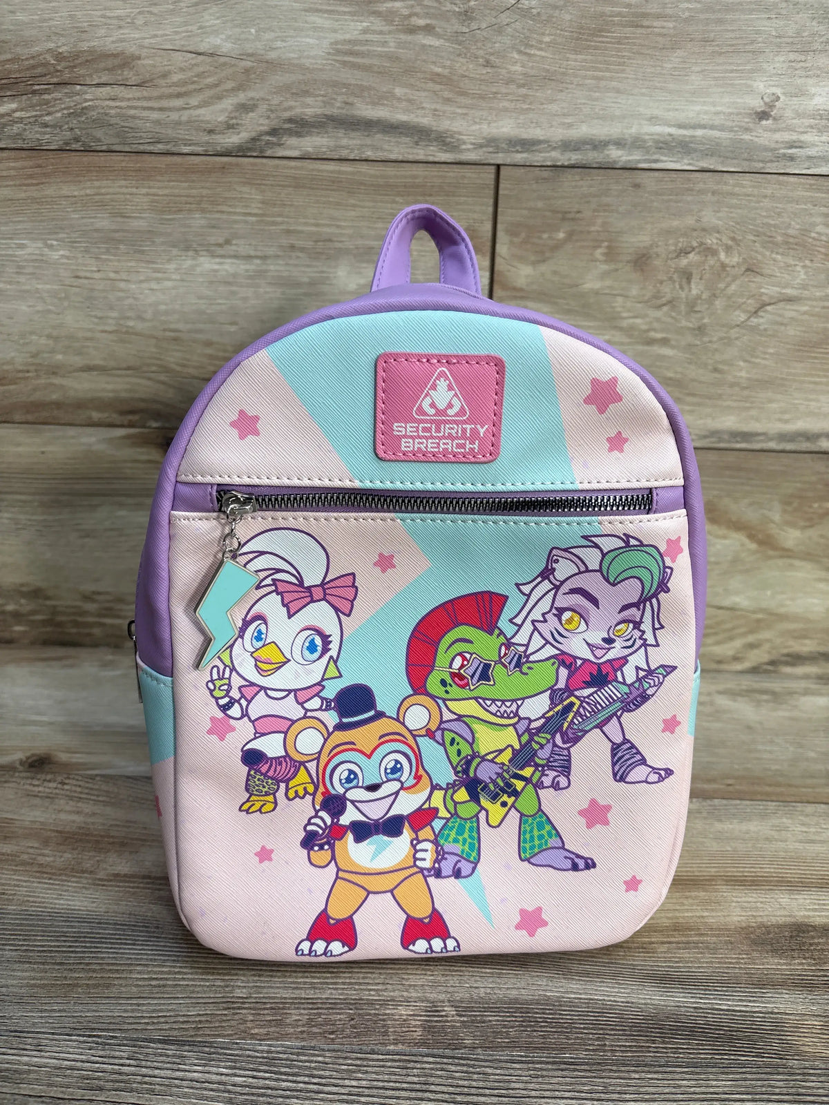 Front view of Five Nights At Freddy’s: Security Breach chibi mini backpack with Glamrock Animatronics and lightning charm