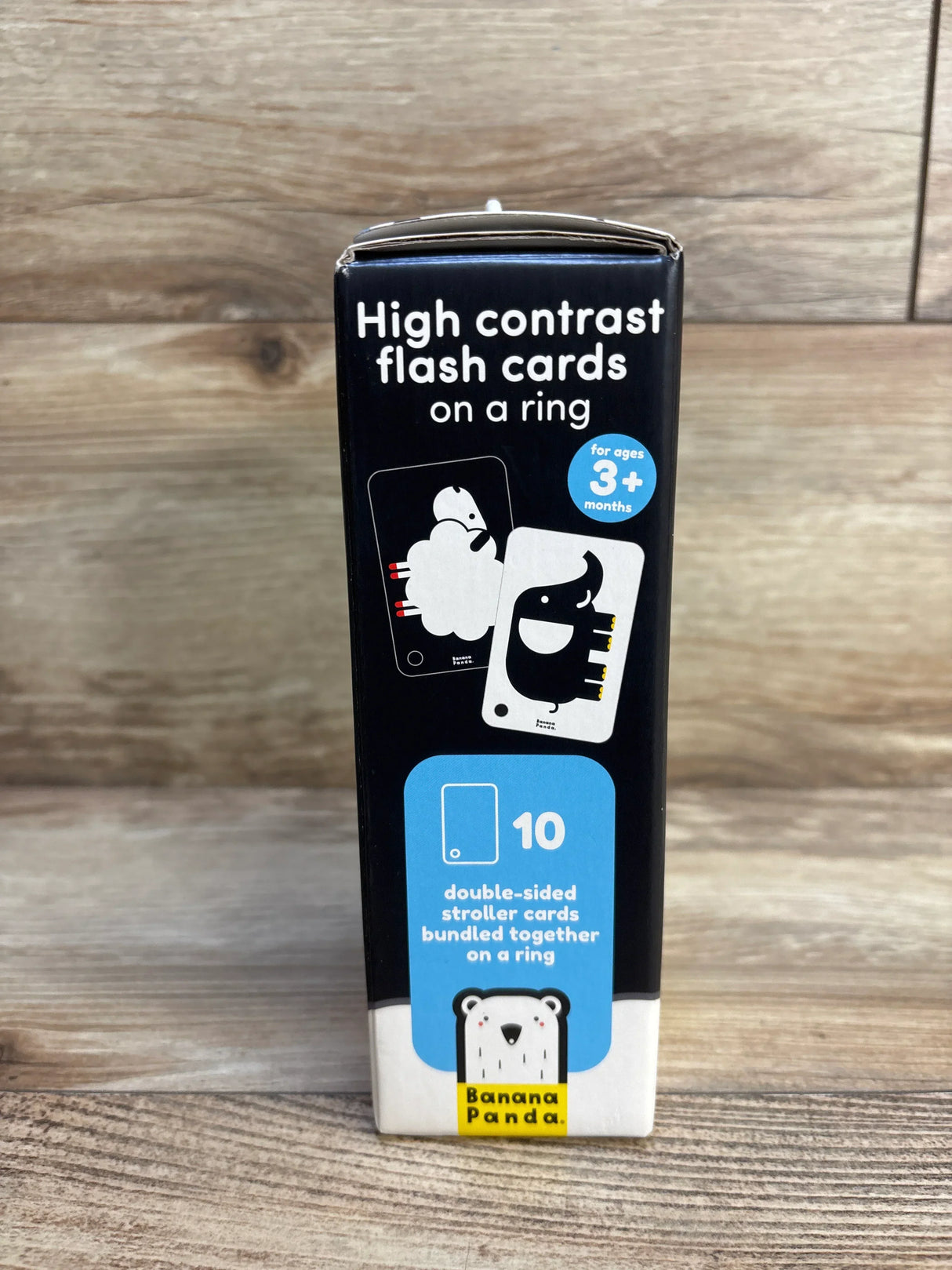 Front view of Banana Panda high contrast flash cards box showing 10 double-sided stroller cards on a ring on wood background