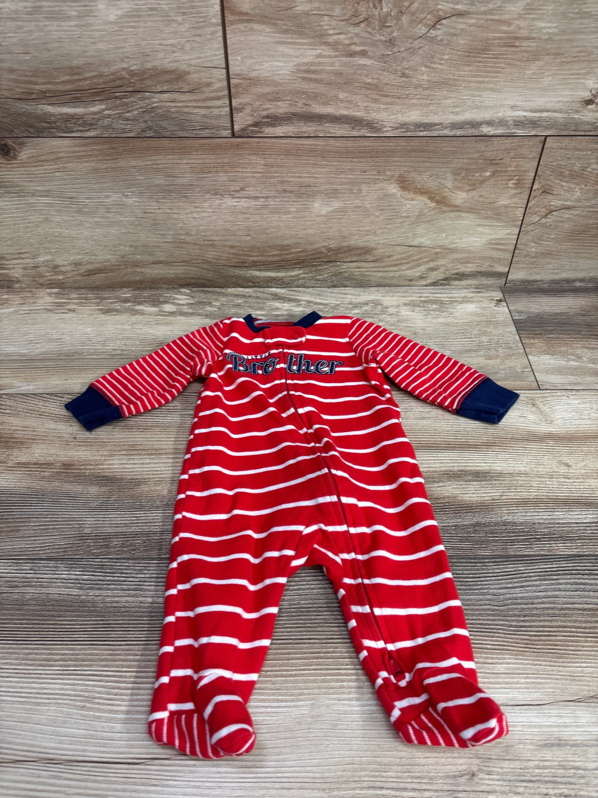 Red and white striped infant sleeper with 'Big Brother' text and navy cuffs