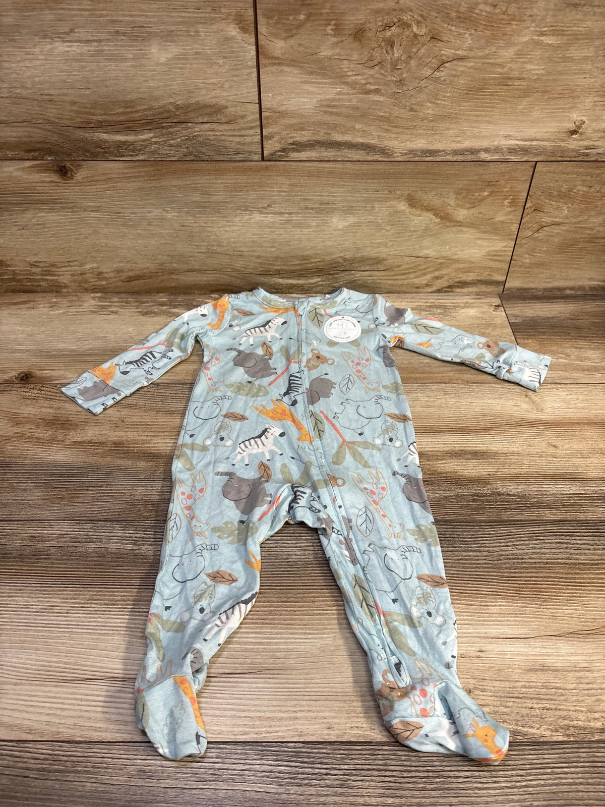 Front view of a blue Huggies viscose baby sleeper showcasing long sleeves, footed legs, animal print, and a front zipper