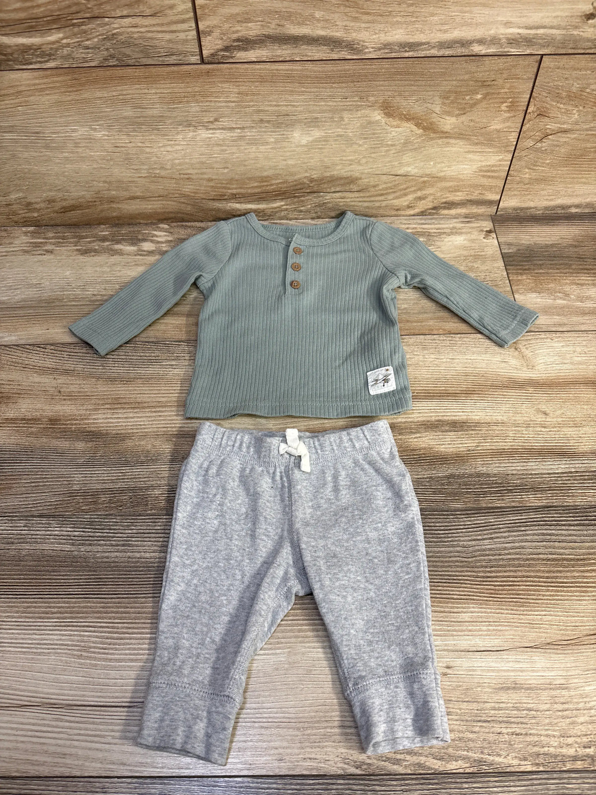 Carter's 2pc ribbed henley shirt in green and grey pants set for babies on wood background