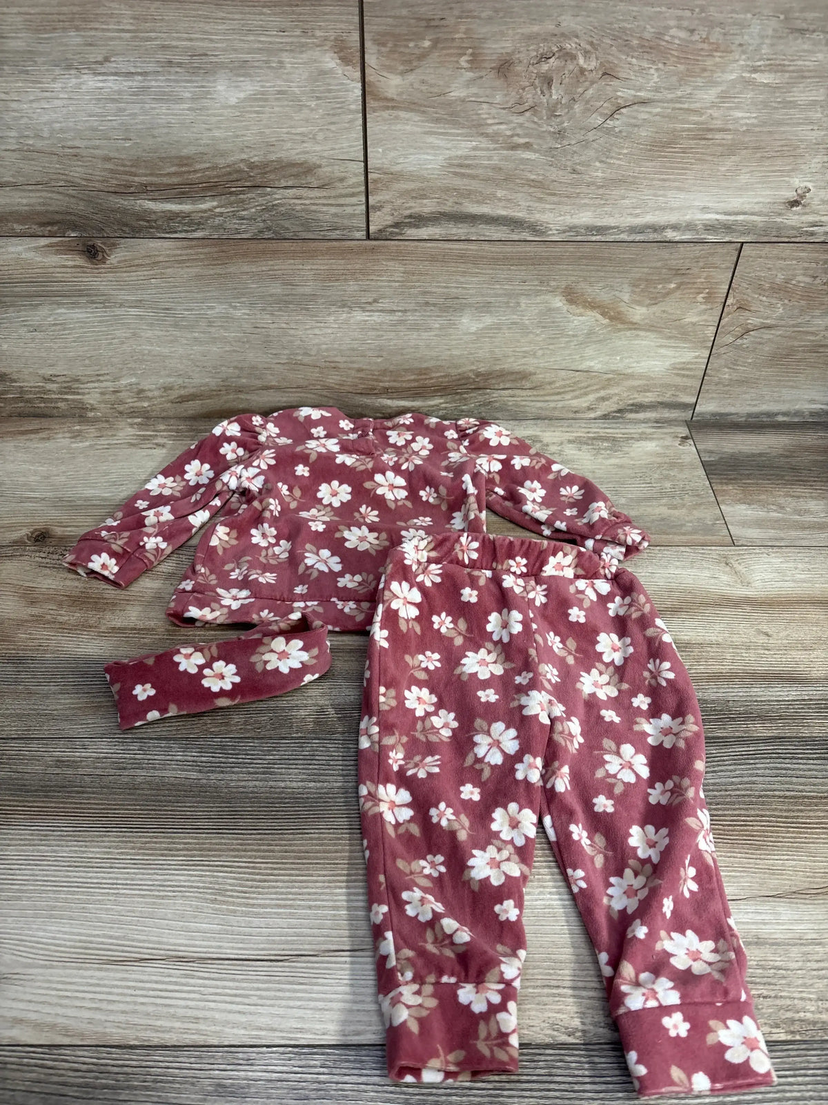 Girls pink floral pajama set with long sleeve top, pants, and matching headband