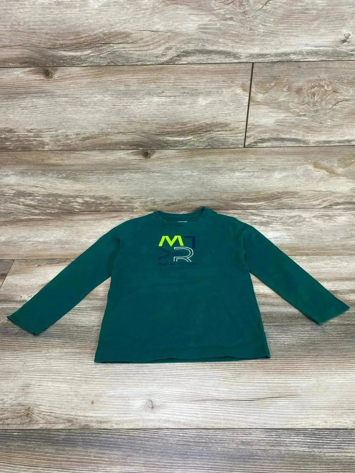 Flat lay of Mayoral long-sleeve green kids shirt size 5T showcasing multicolor MR logo on chest with wood plank background