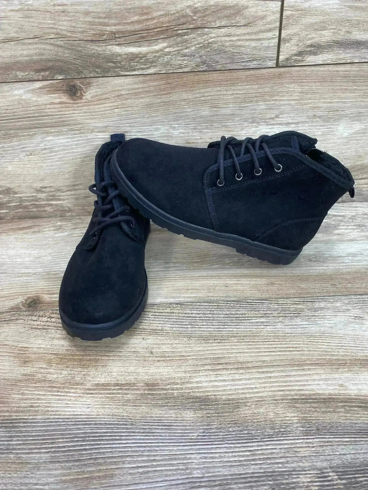 Front three-quarter view of Cat and Jack Ronin children’s black ankle boots showing lace-up detail and rubber tread on white background