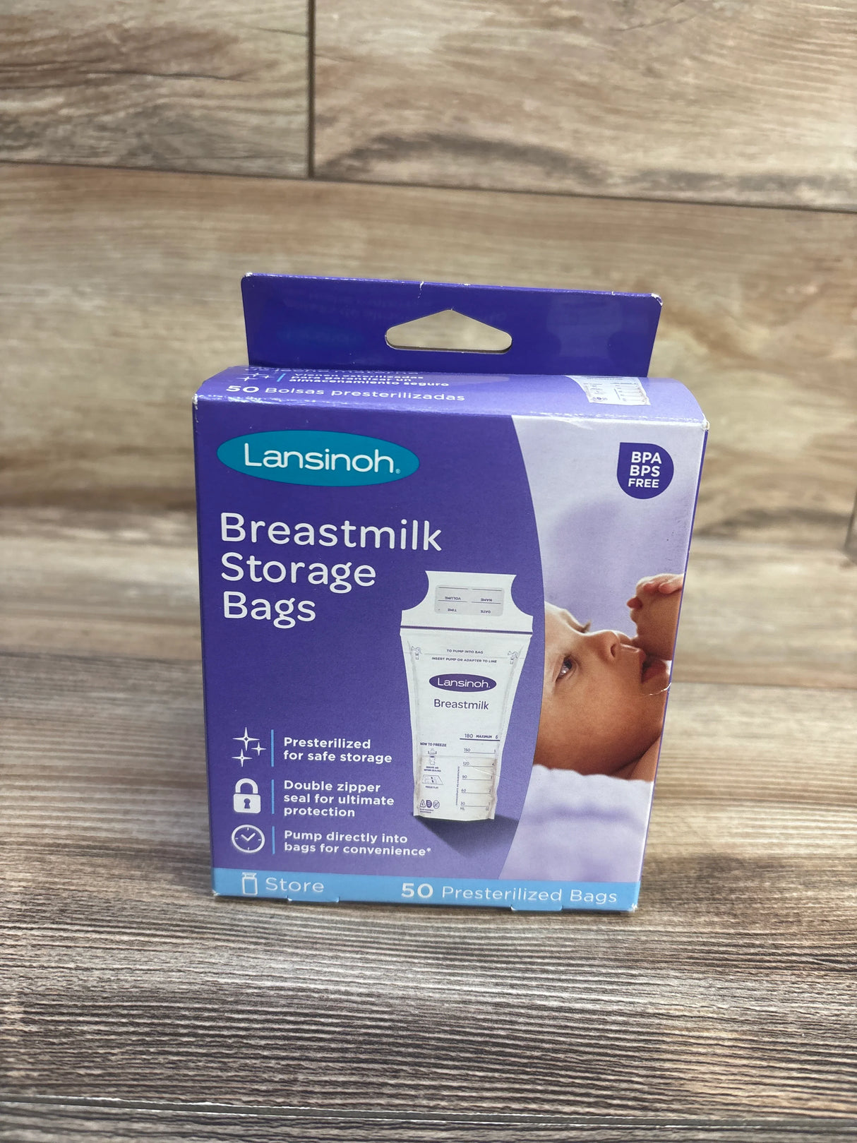 Front of Lansinoh breastmilk storage bags box, purple packaging showing product name, baby photo, and 50 presterilized bags