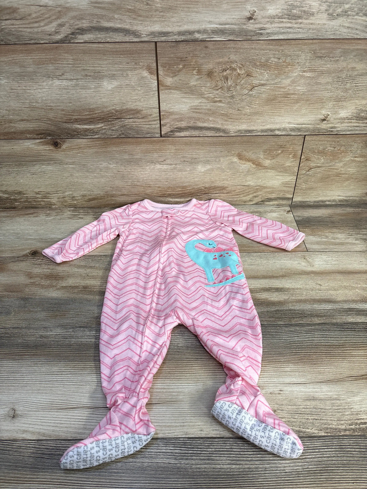 Front view of pink Simple Joys sleeper showcasing chevron pattern, footed legs, and turquoise animal applique