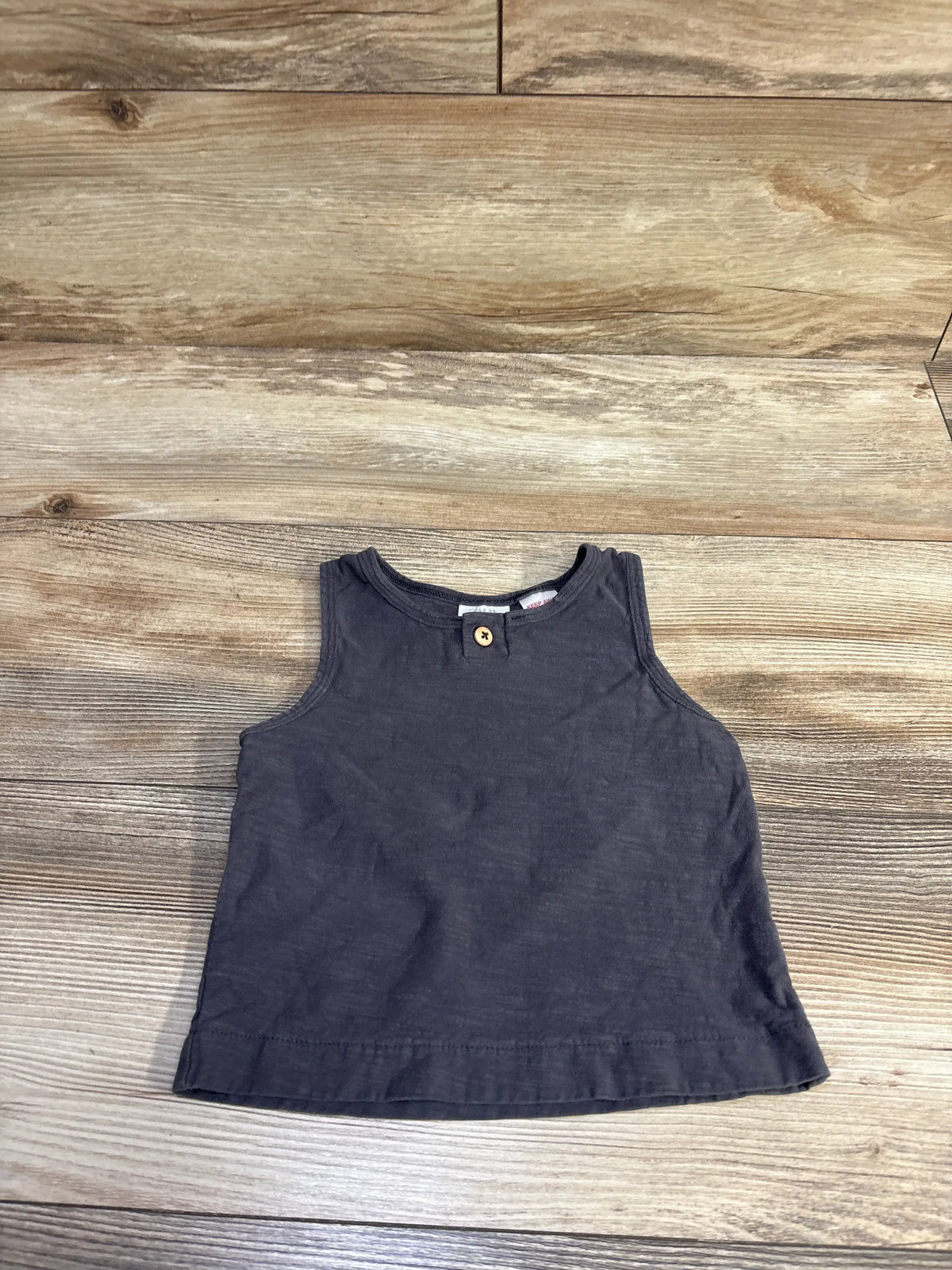 Grey Me n Mommy To Be baby tank top for size 12-18m on a wooden background