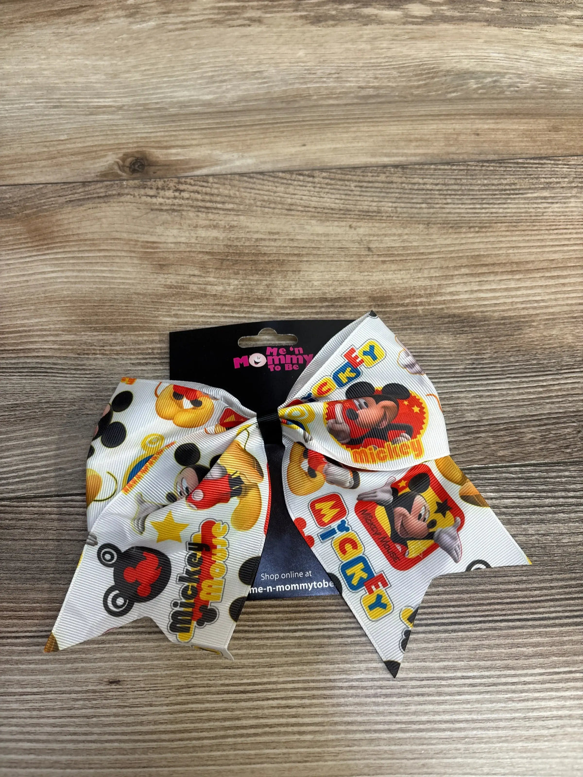 Mickey Mouse printed white hair bow on wood background with Me 'n Mommy To Be tag