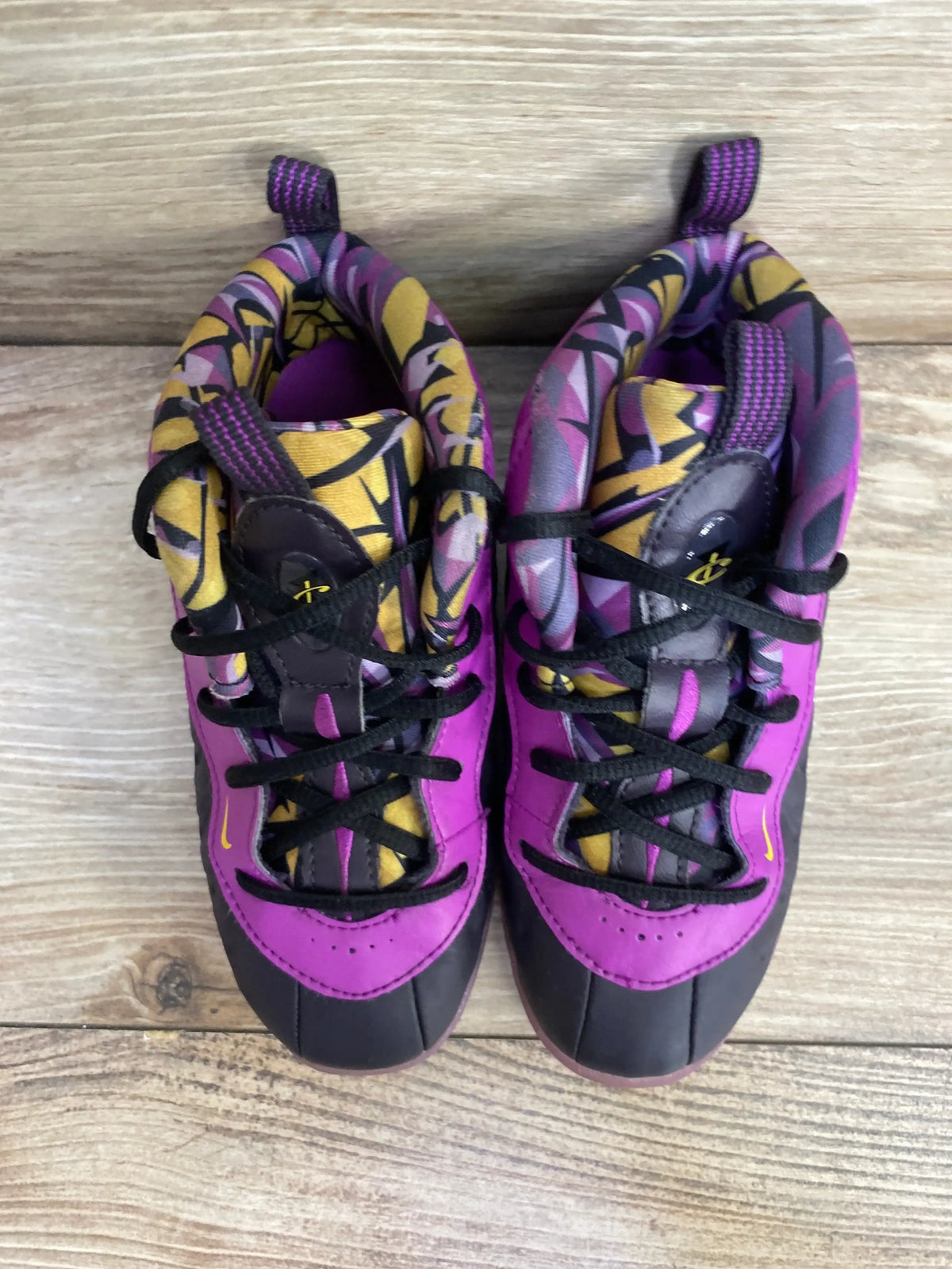 Top view of Nike Little Posite One TD toddler sneakers in cave purple with patterned yellow and purple lining and black laces