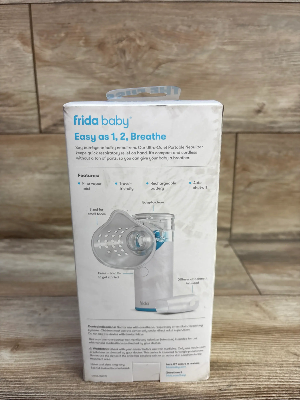 Front view of Frida Baby Ultra-Quiet Portable Nebulizer box showing Easy as 1 2 Breathe, fine mist, and small-face mask