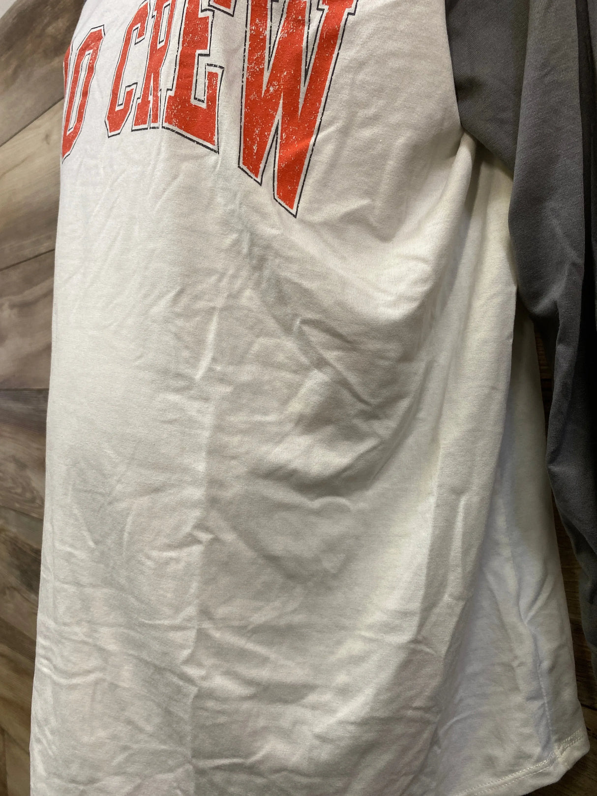 White t-shirt with red 'Crew' graphic print, soft cotton fabric, casual kids or maternity wear