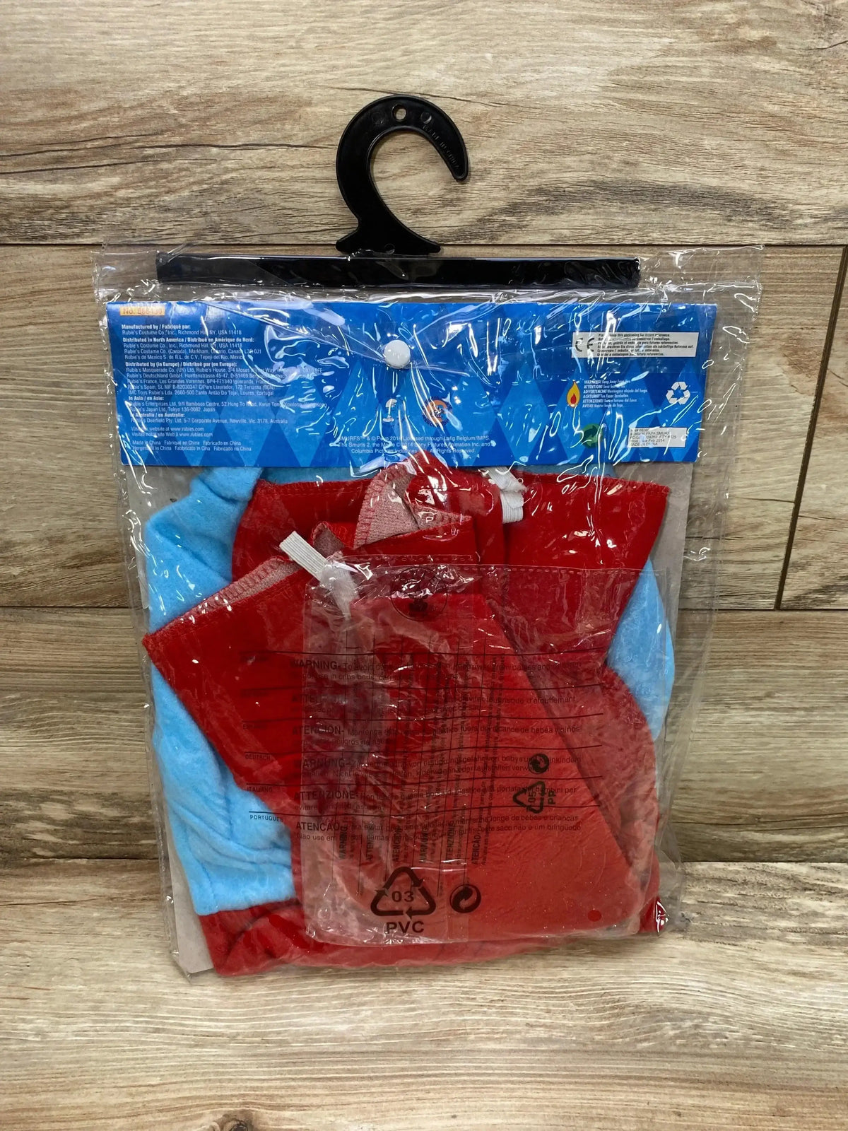 Front view of Rubie’s Papa Smurf costume in blue and red packaging with a matching red hat