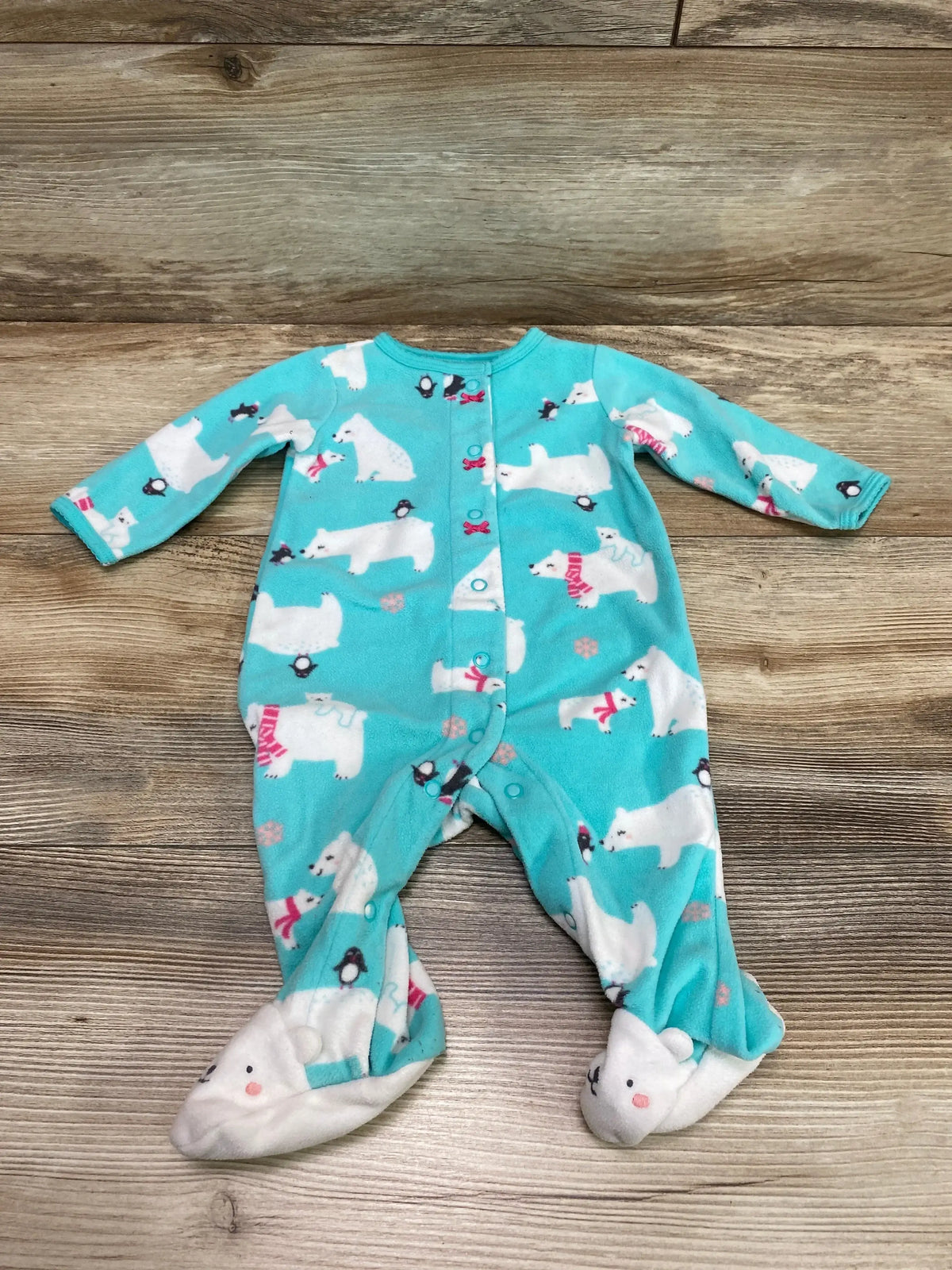 Front view of Carter’s mint blanket sleeper, size 3m, with polar bear print, snaps, and footed legs on wood