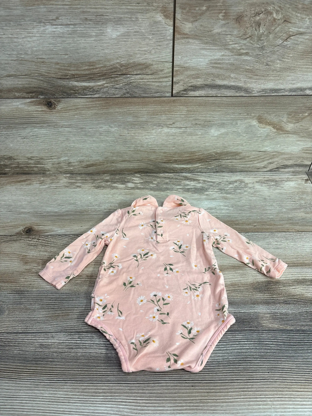 Front view of Angel Dear pink newborn bodysuit showing Peter Pan collar and snap closures on white background