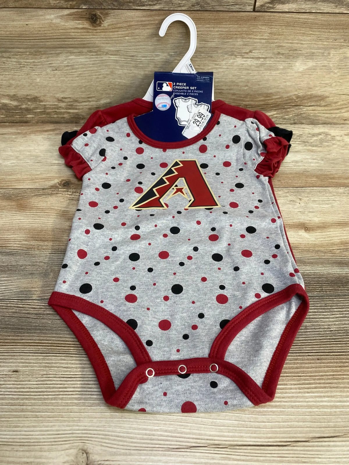 Front view of grey Arizona Diamondbacks 2-piece creeper set with dotted pattern, team logo, ruffle sleeves, and three snaps