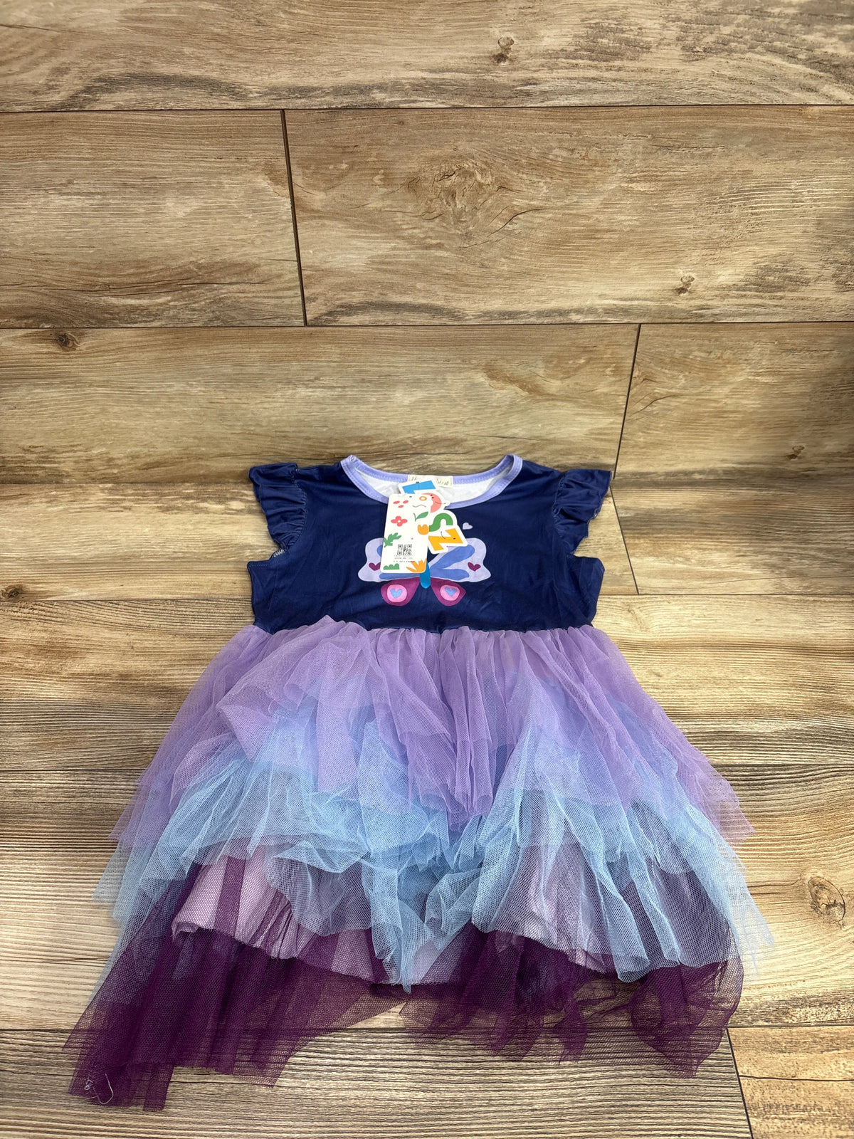 Front view of LingQiShiZu butterfly tulle dress showcasing layered purple and blue tulle skirt with navy bodice on a wood floor