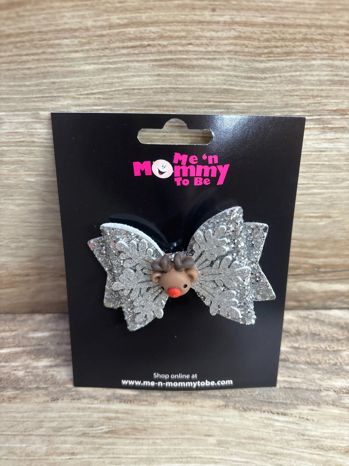 Glitter snowflake hair bow with reindeer charm for kids, festive holiday accessory