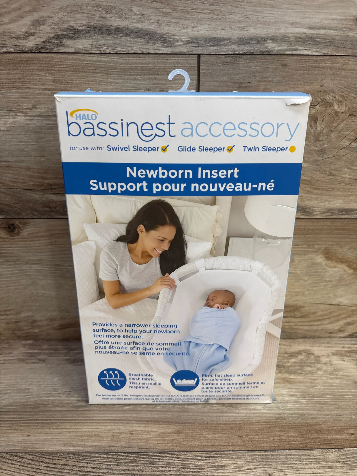 HALO BassiNest Newborn Insert accessory box with mom and baby, wood background