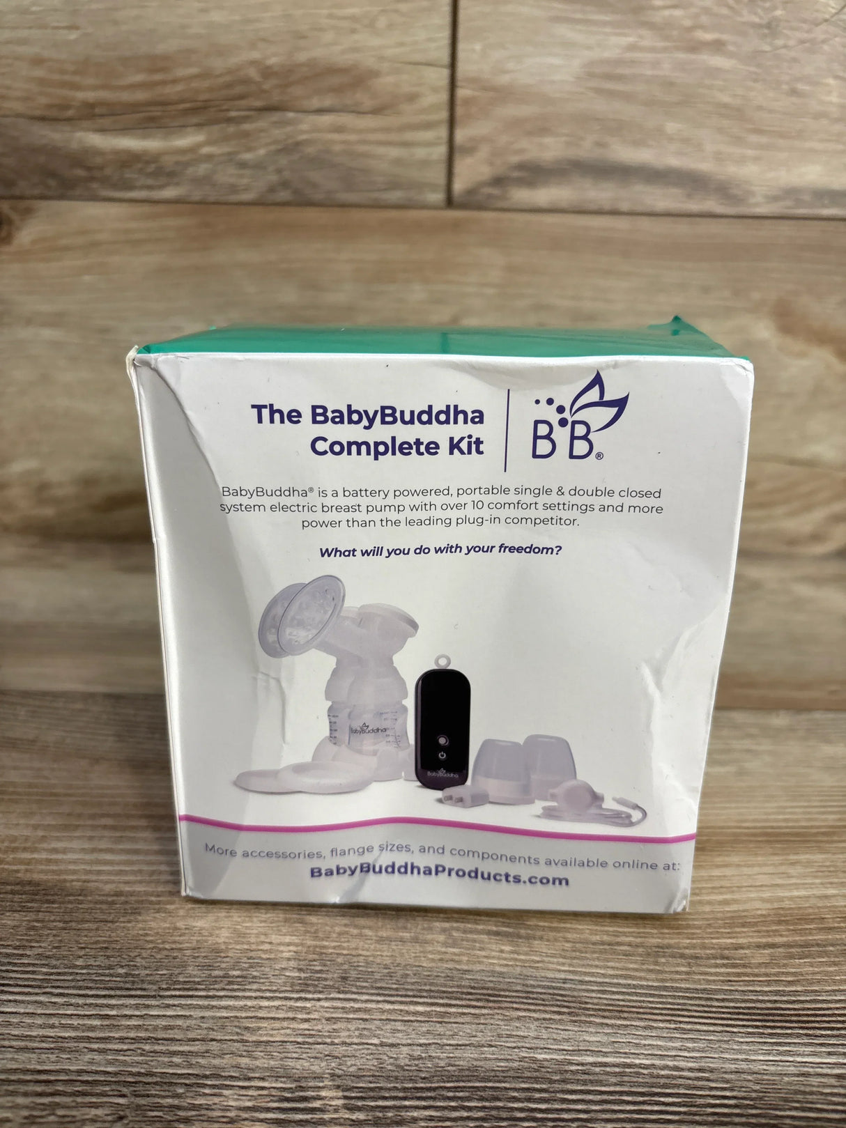 BabyBuddha Complete Kit electric breast pump box on wooden floor with product image and description
