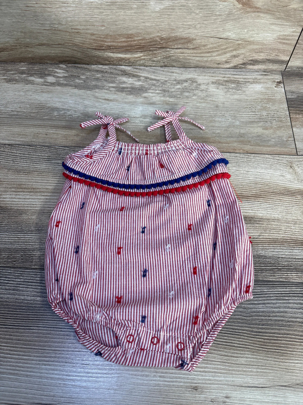 Cat & Jack sleeveless red and white striped bubble romper with blue pom pom trim