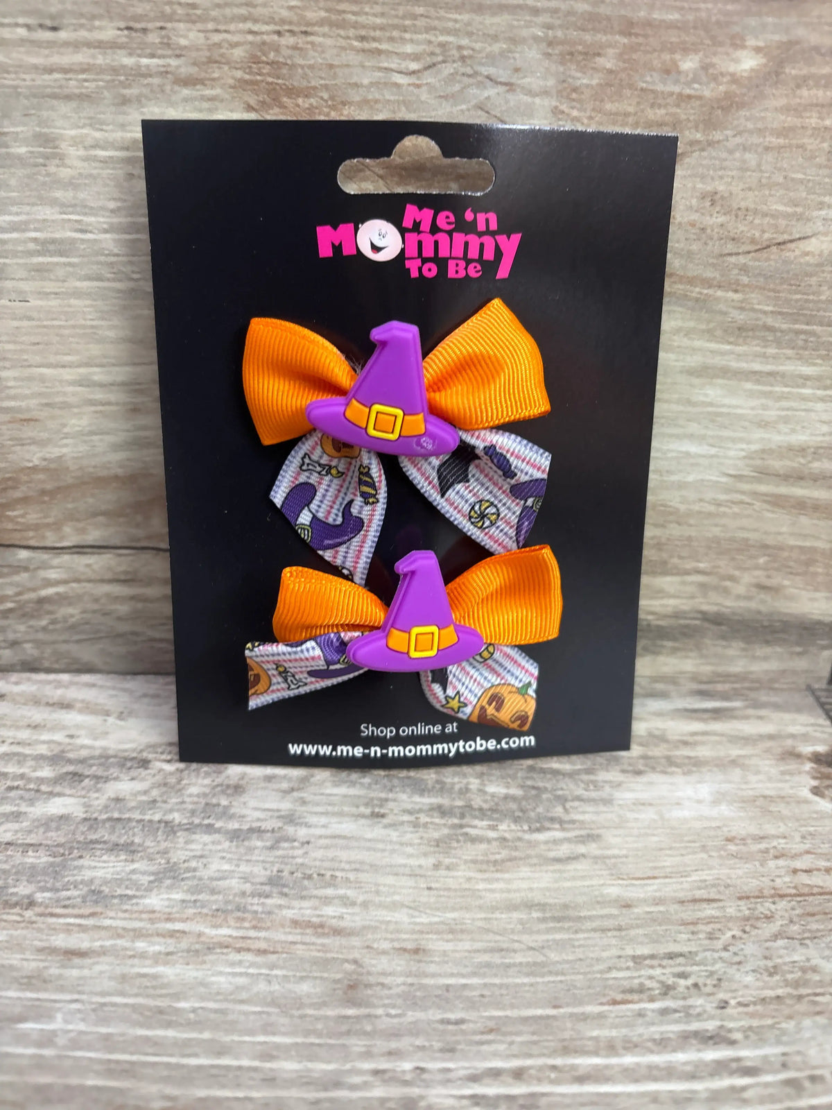 Two Me n Mommy To Be witch hat applique hair bows in orange and patterned purple.