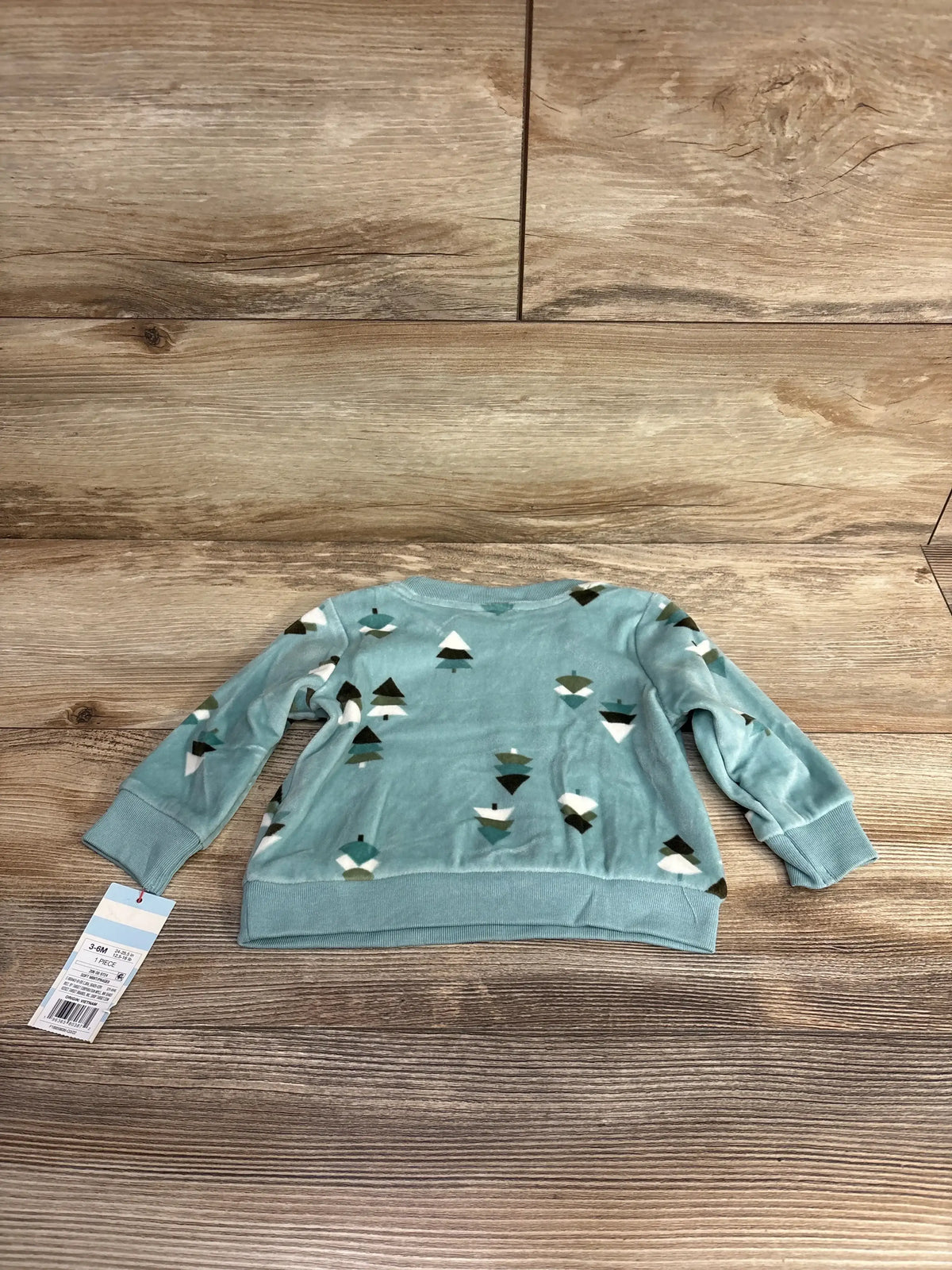 Blue long sleeve baby shirt with white, green, and brown geometric tree pattern, size 3-6 months tag visible