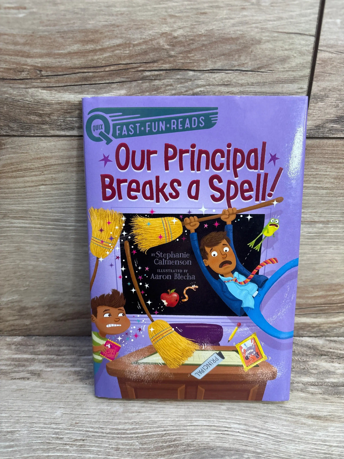 Children's chapter book 'Our Principal Breaks a Spell' with cartoon magical school scene