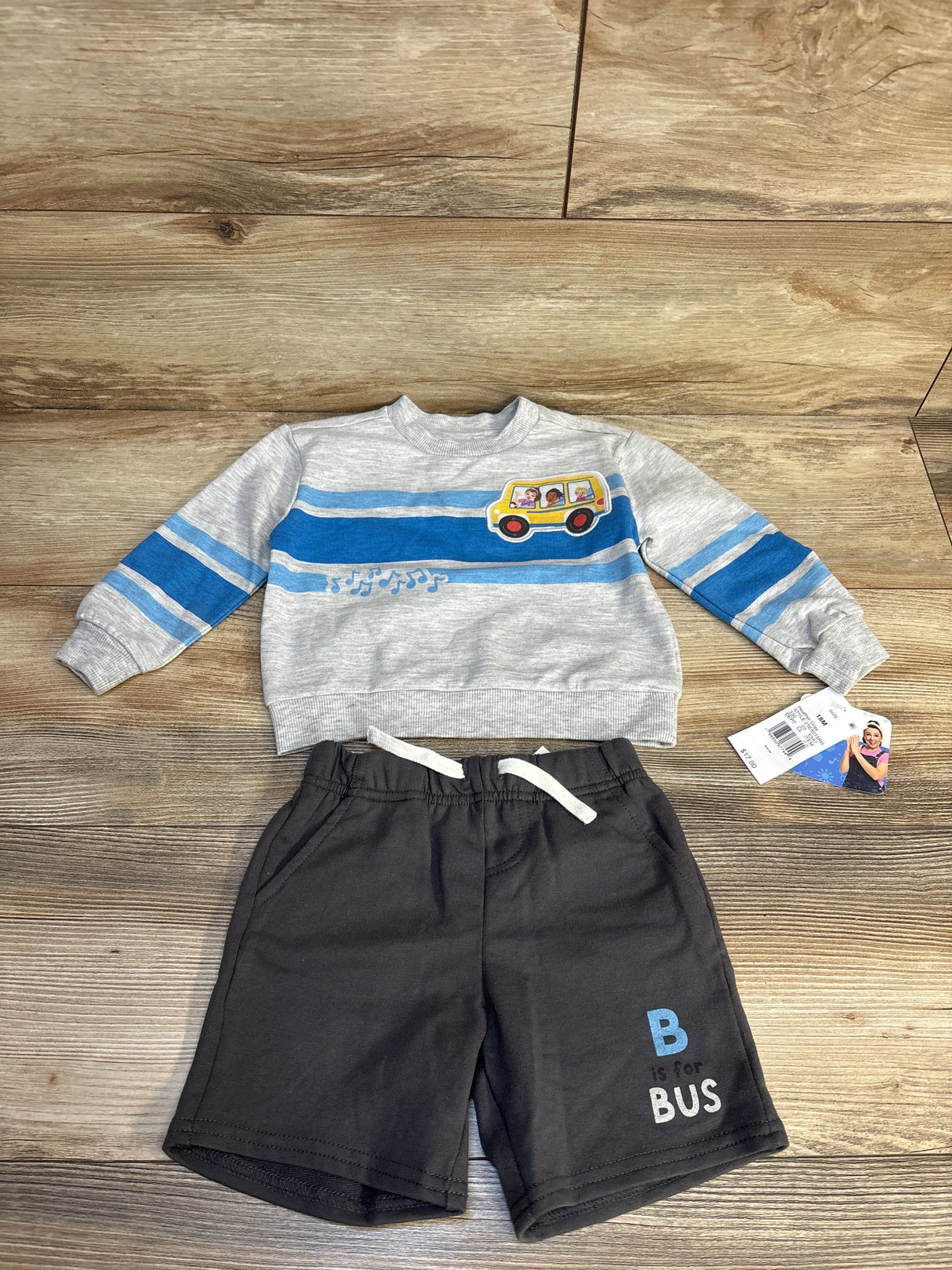 Toddler boy's outfit with gray sweatshirt featuring school bus and black shorts, kids clothes