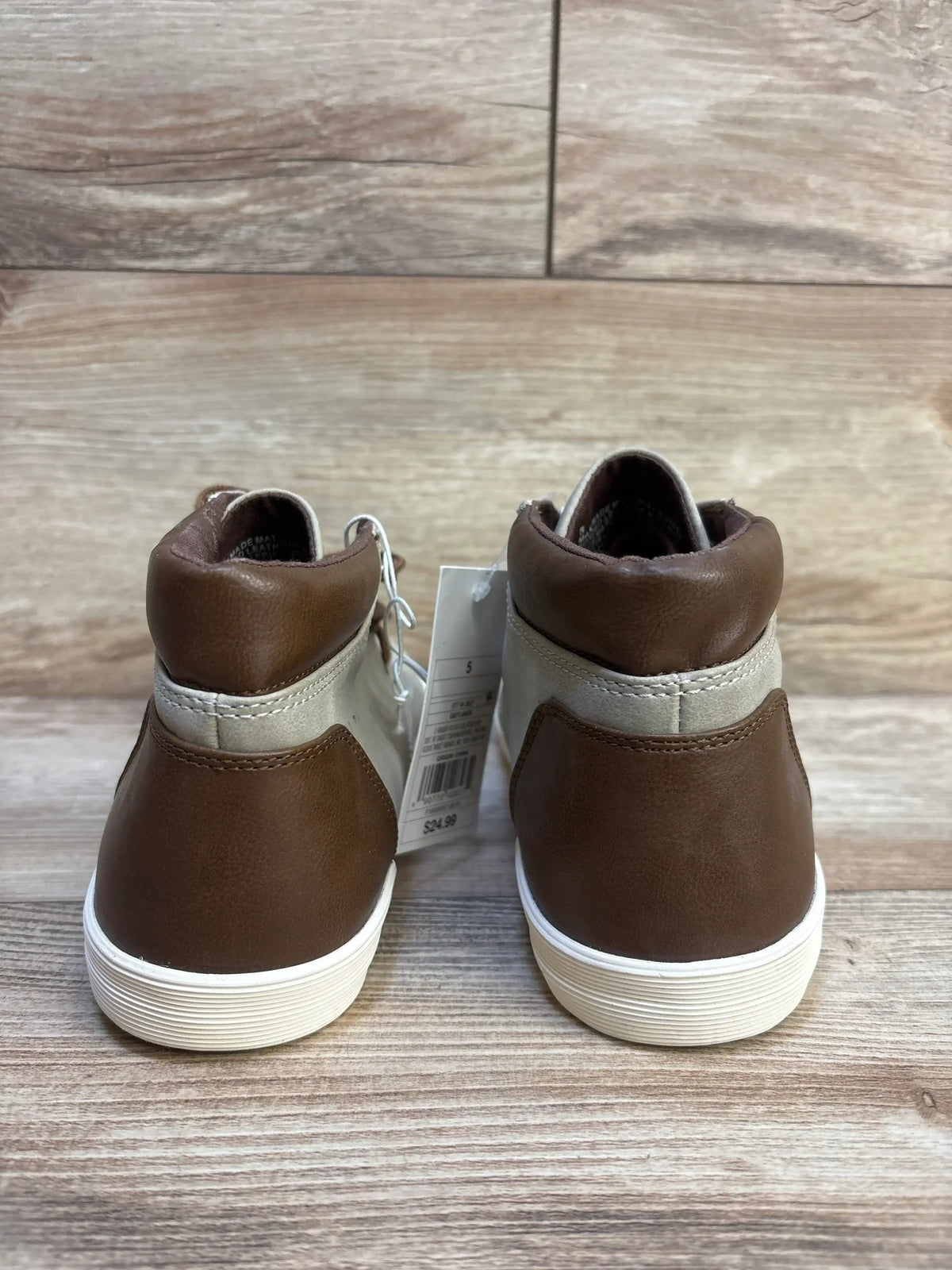 Rear view of Cat & Jack Jakob toddler boots showing brown and gray upper, white soles and size 5Y tag on wood floor
