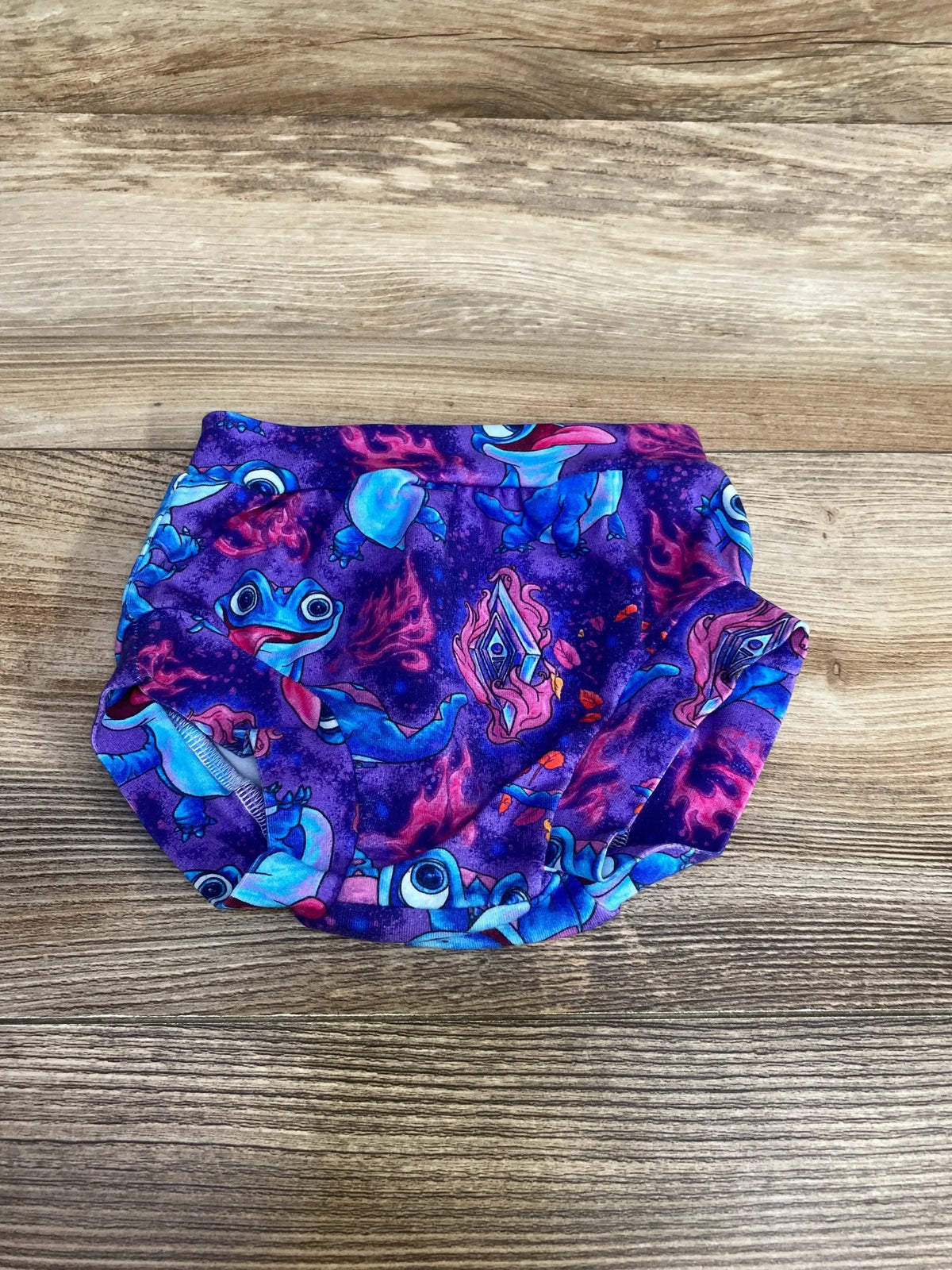 Front view of handmade Disney Frozen Bruni bloomer in purple, size 3-6m, showcasing Bruni print on wood