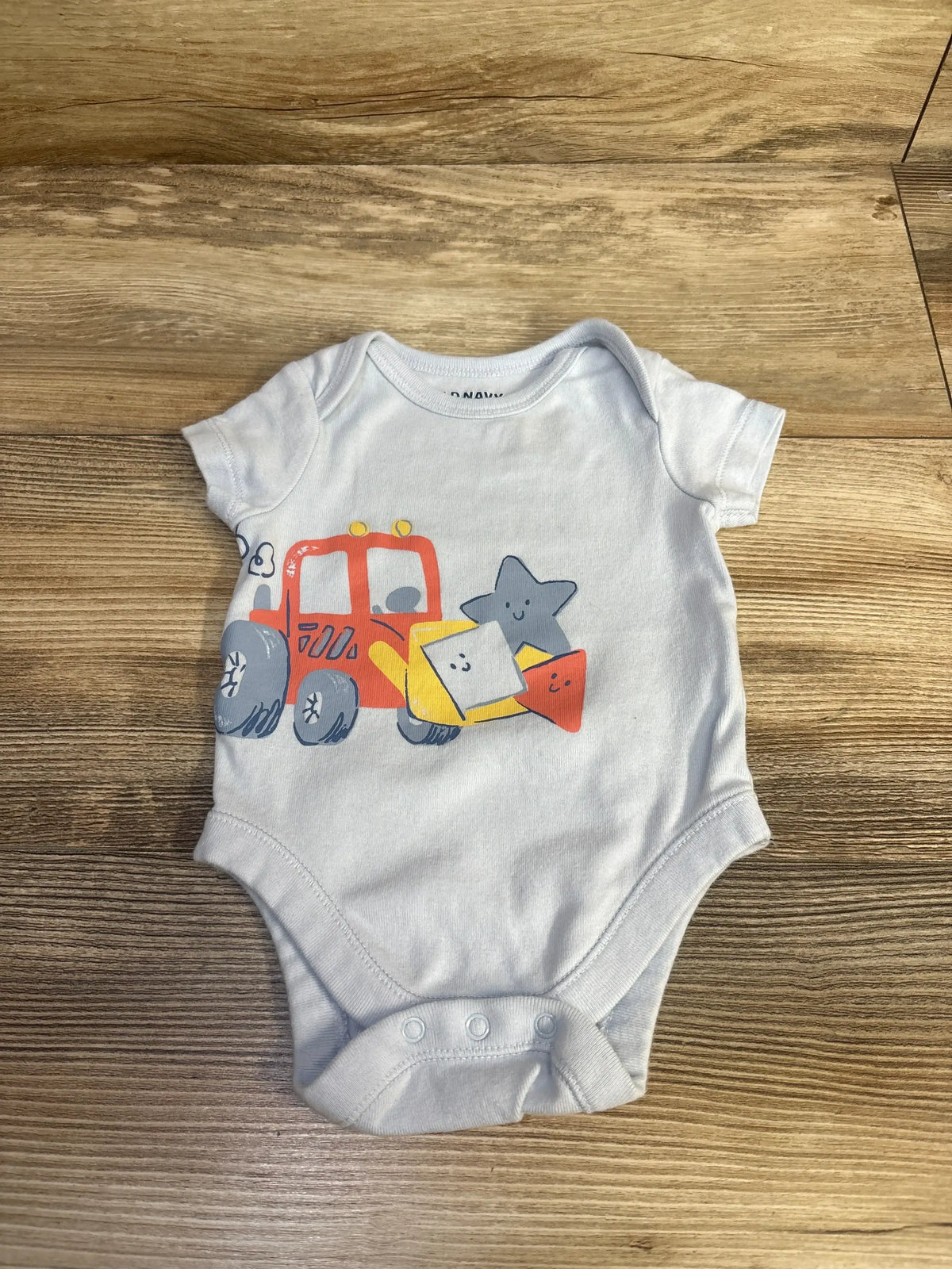 Front view of Old Navy newborn blue bodysuit (0-3 months) showing short sleeves and snap closures on a white background